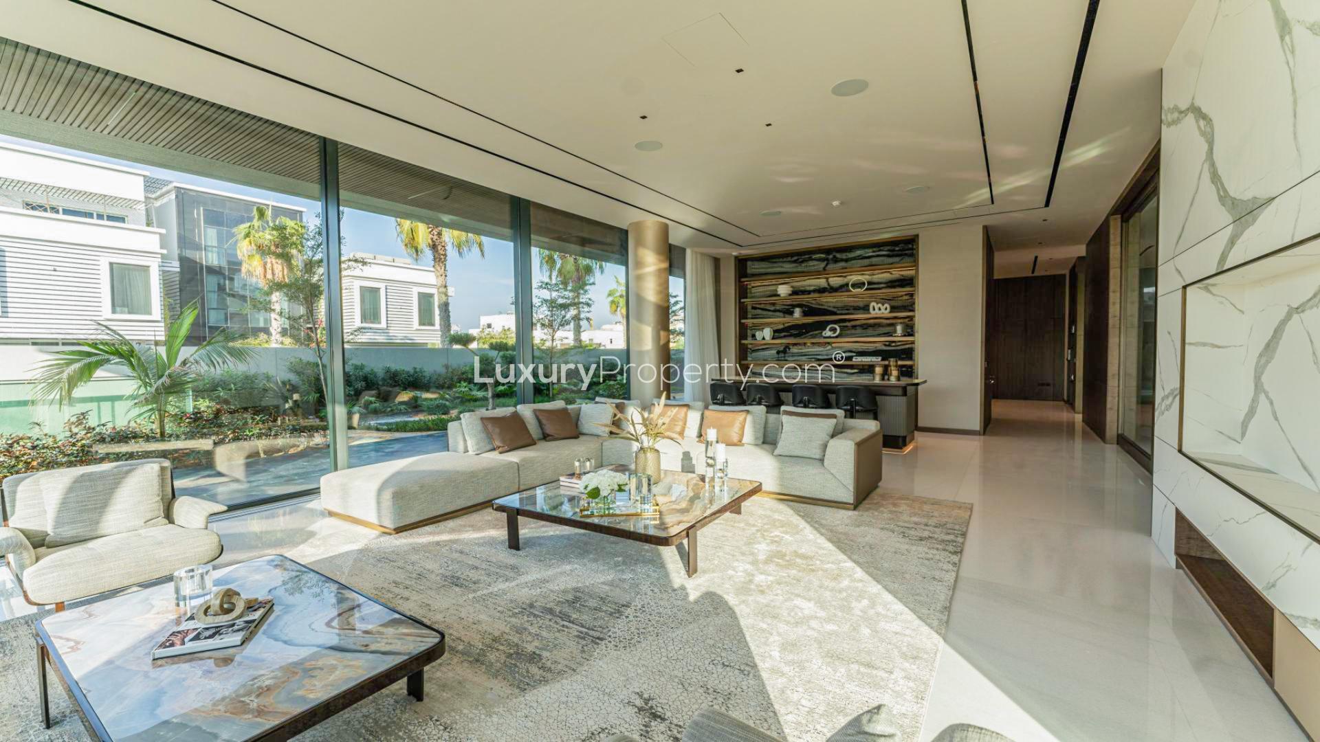 Modern luxury villa exterior in Pearl Jumeirah, featuring sleek design and lush landscaping