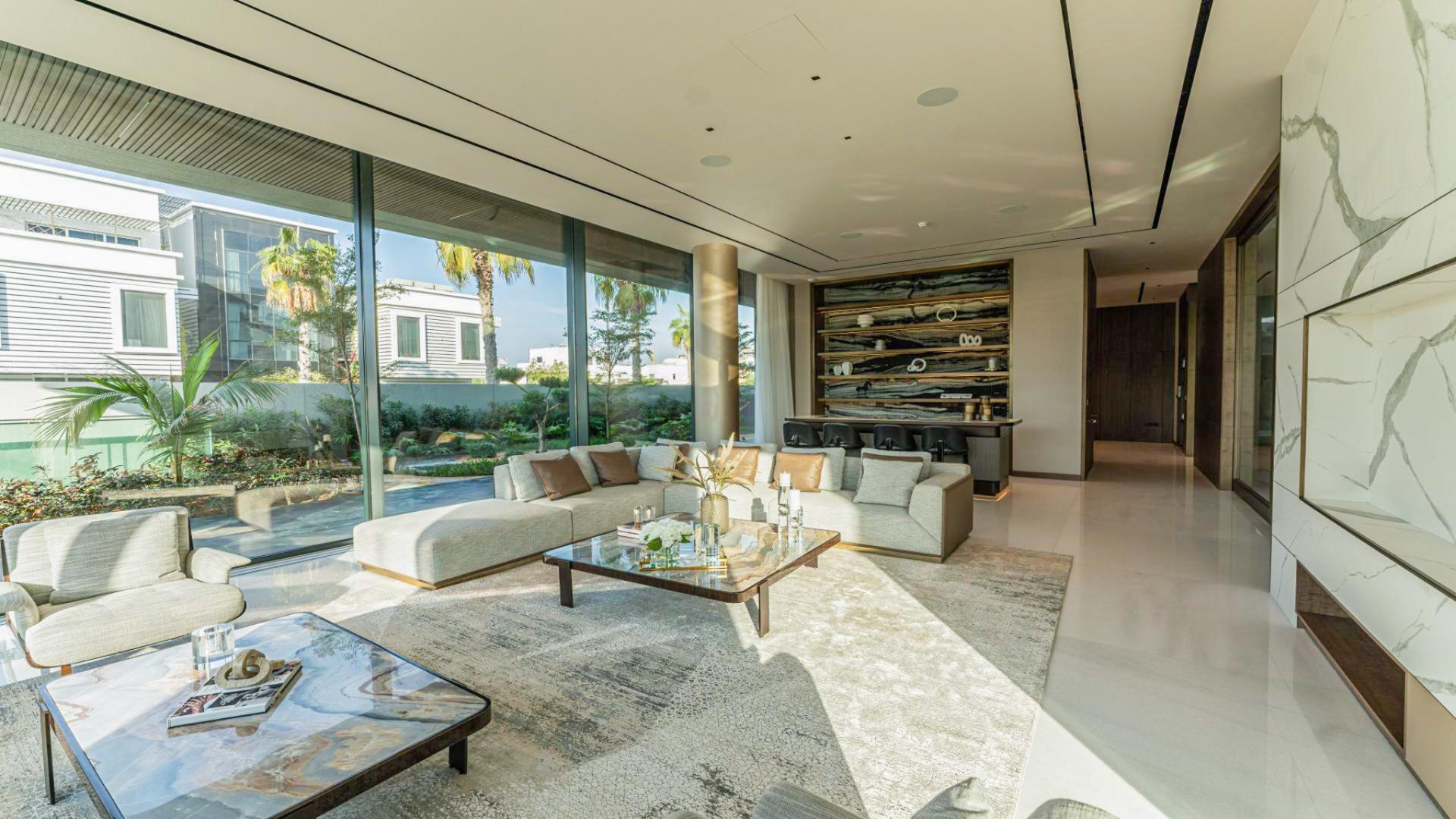 Modern luxury villa exterior in Pearl Jumeirah, featuring sleek design and lush landscaping