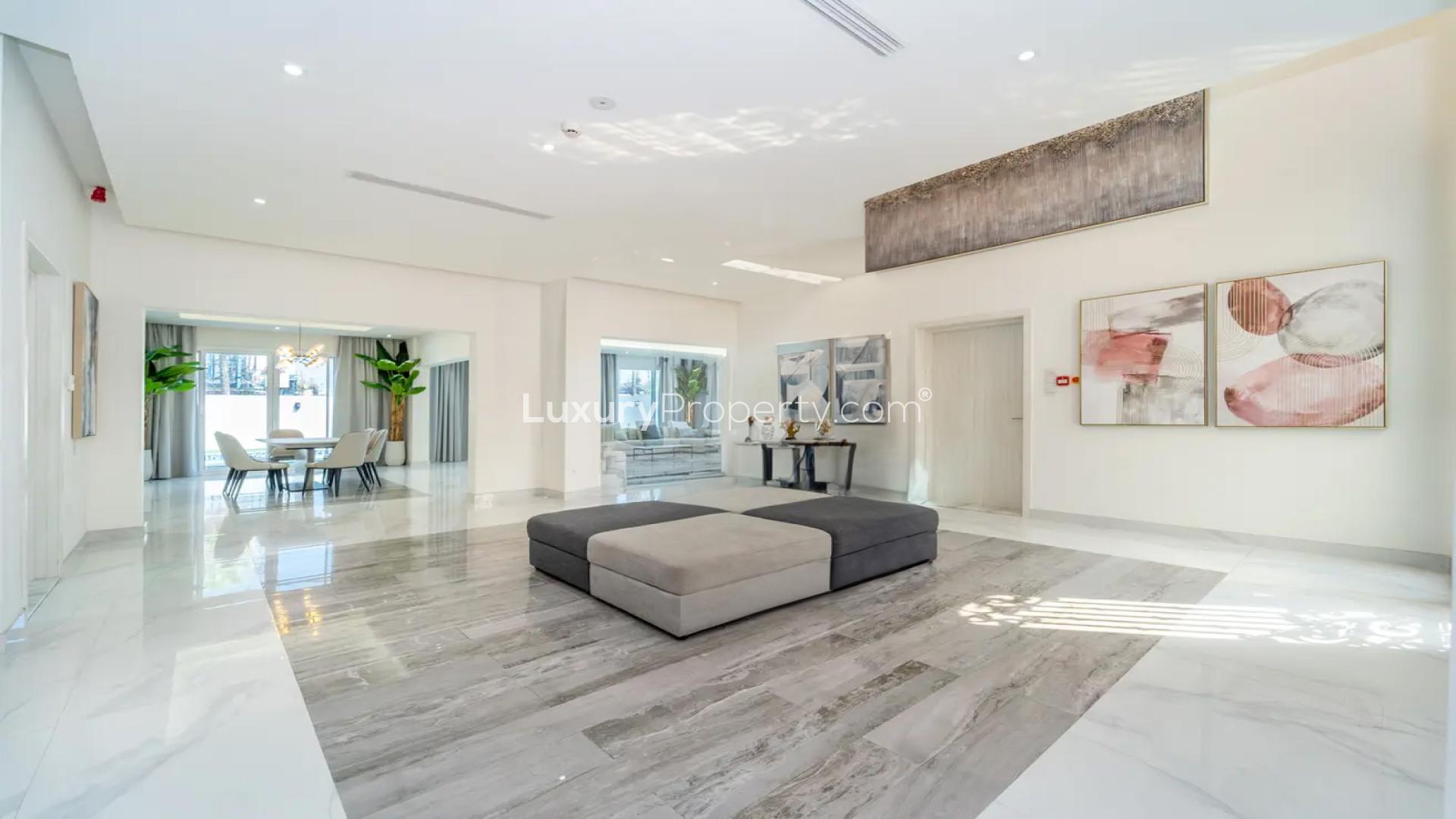 Spacious modern living area in Pearl Jumeirah villa for sale, featuring elegant marble flooring