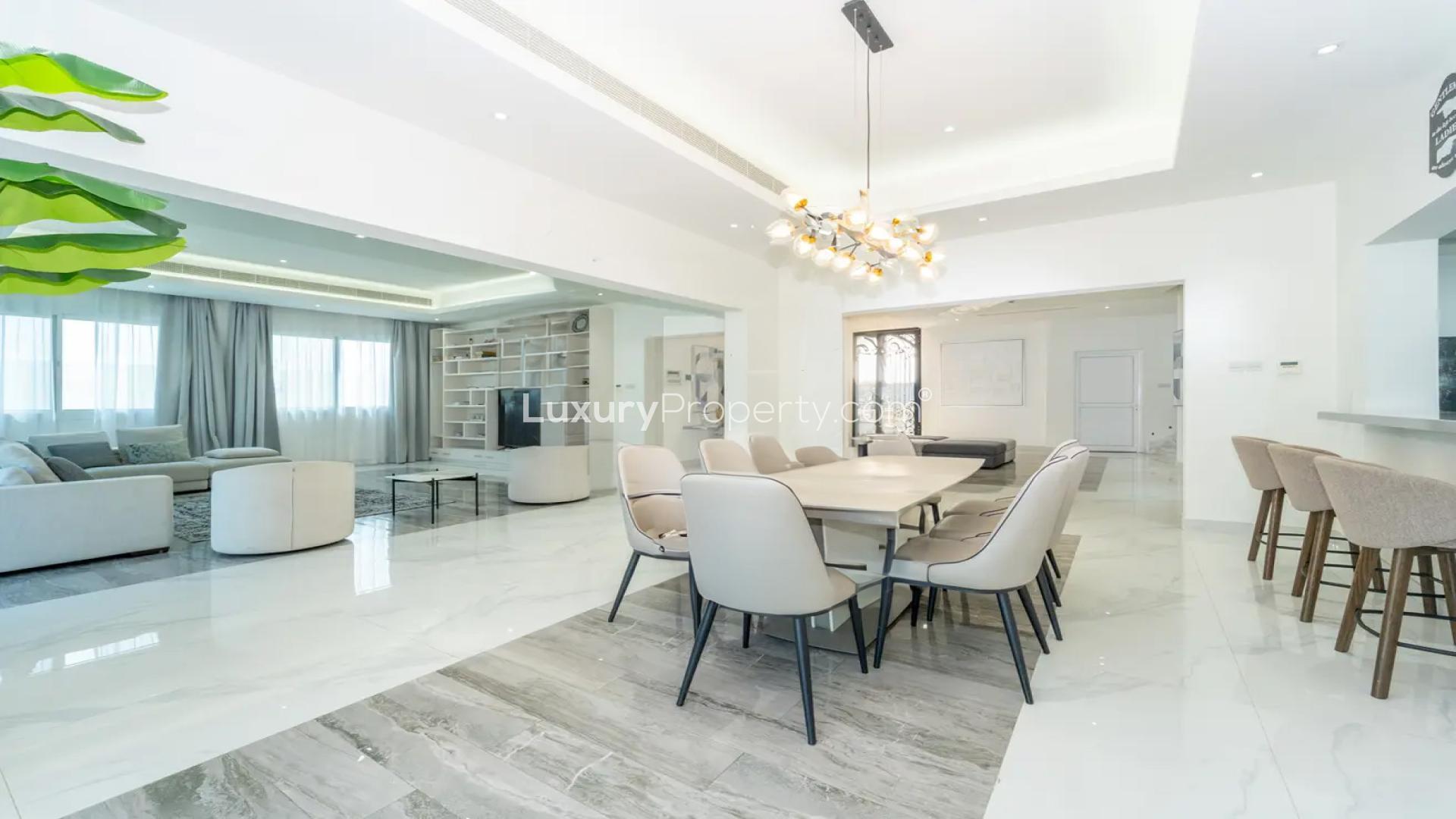 Luxurious living room in Pearl Jumeirah villa, spacious seating and modern decor