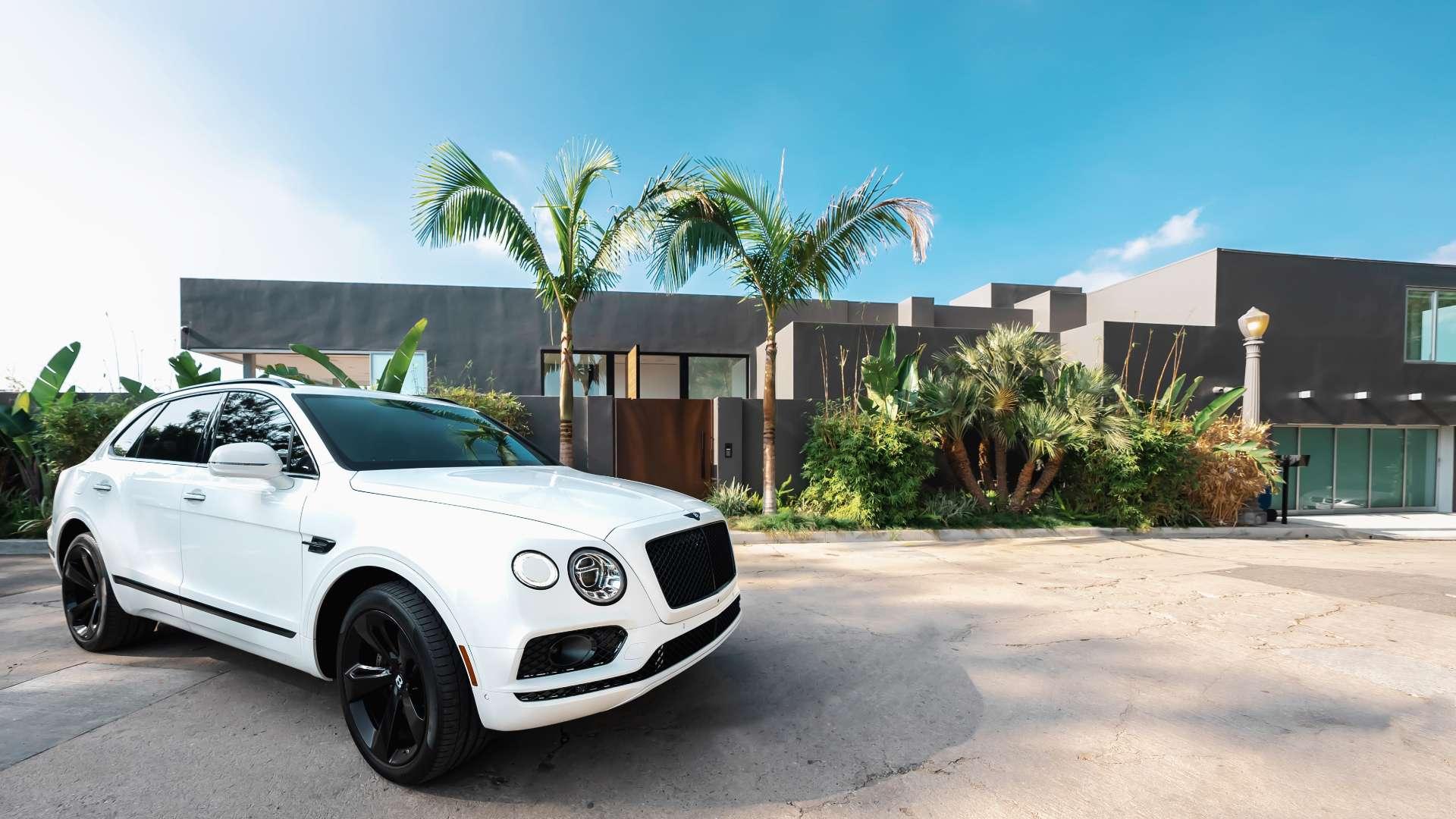 Luxury villa exterior in Beverly Hills, LA, with landscaped garden terraces, for sale