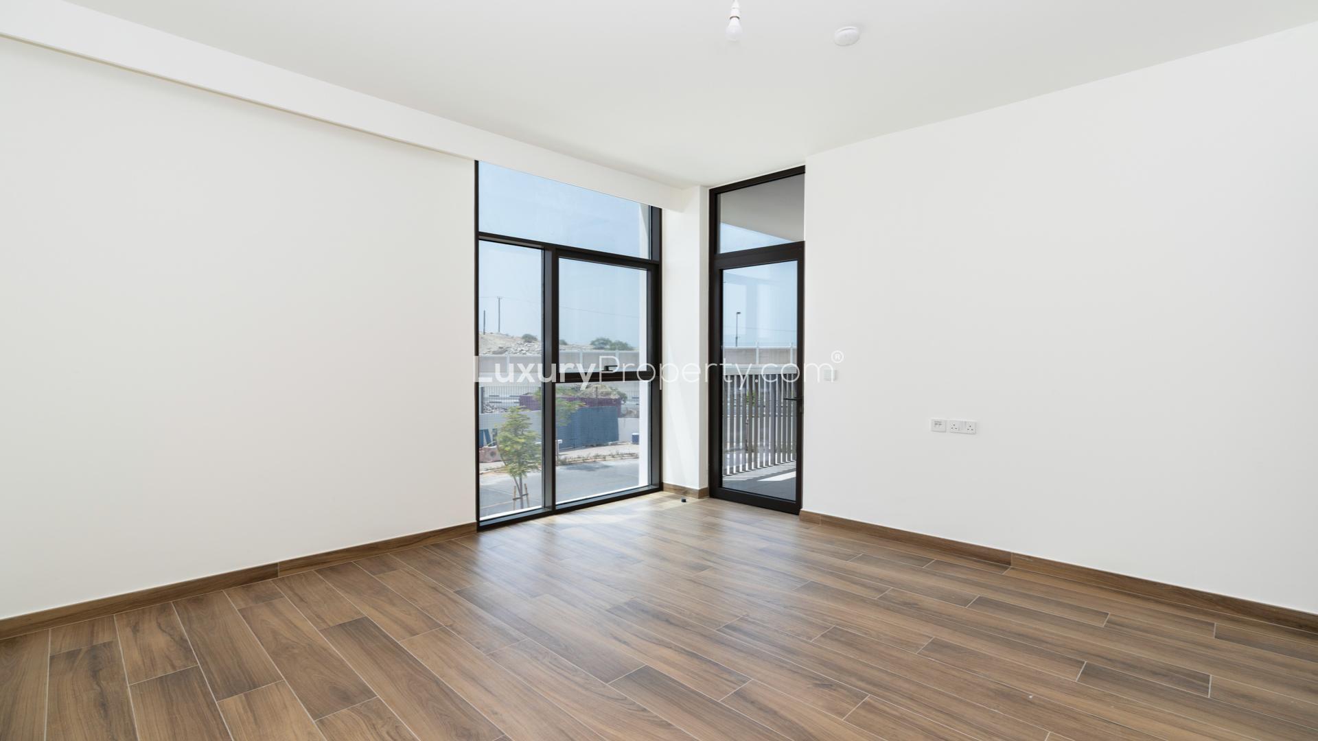 Modern kitchen in Tilal Al Furjan villa for sale, featuring sleek cabinetry and ample space