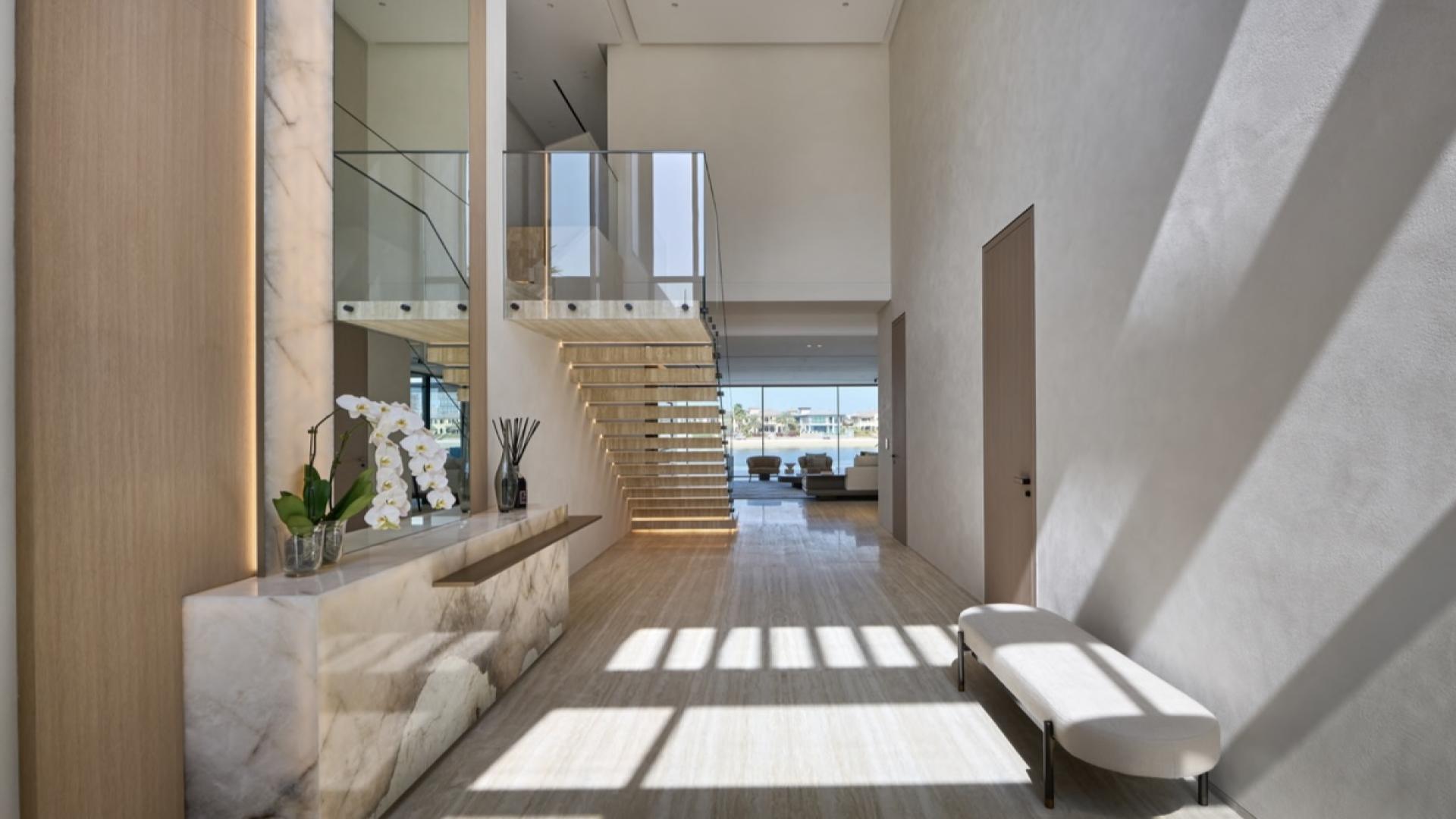 Luxurious master bedroom in Palm Jumeirah villa, elegant design and modern furnishings