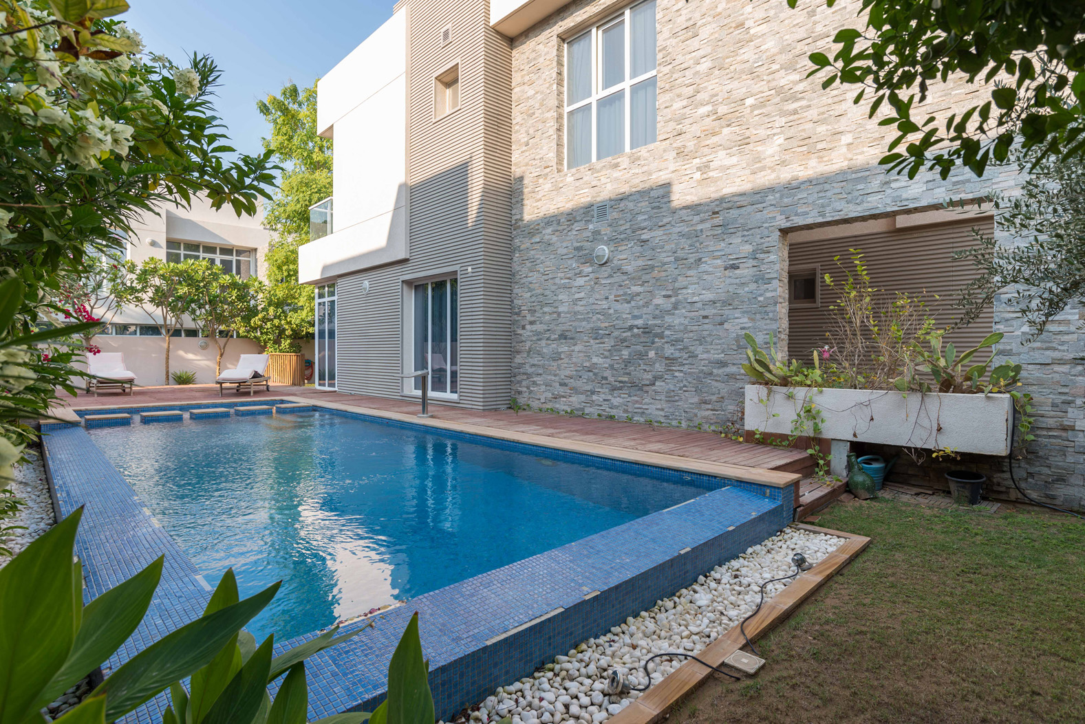 "Luxury villa in Cedre Villas, Dubai Silicon Oasis with private pool and modern design.","Luxurious villa with private pool in Cedre Villas, Dubai Silicon Oasis for sale.",Exterior view of 5-bedroom villa for sale in Cedre Villas, Dubai Silicon Oasis