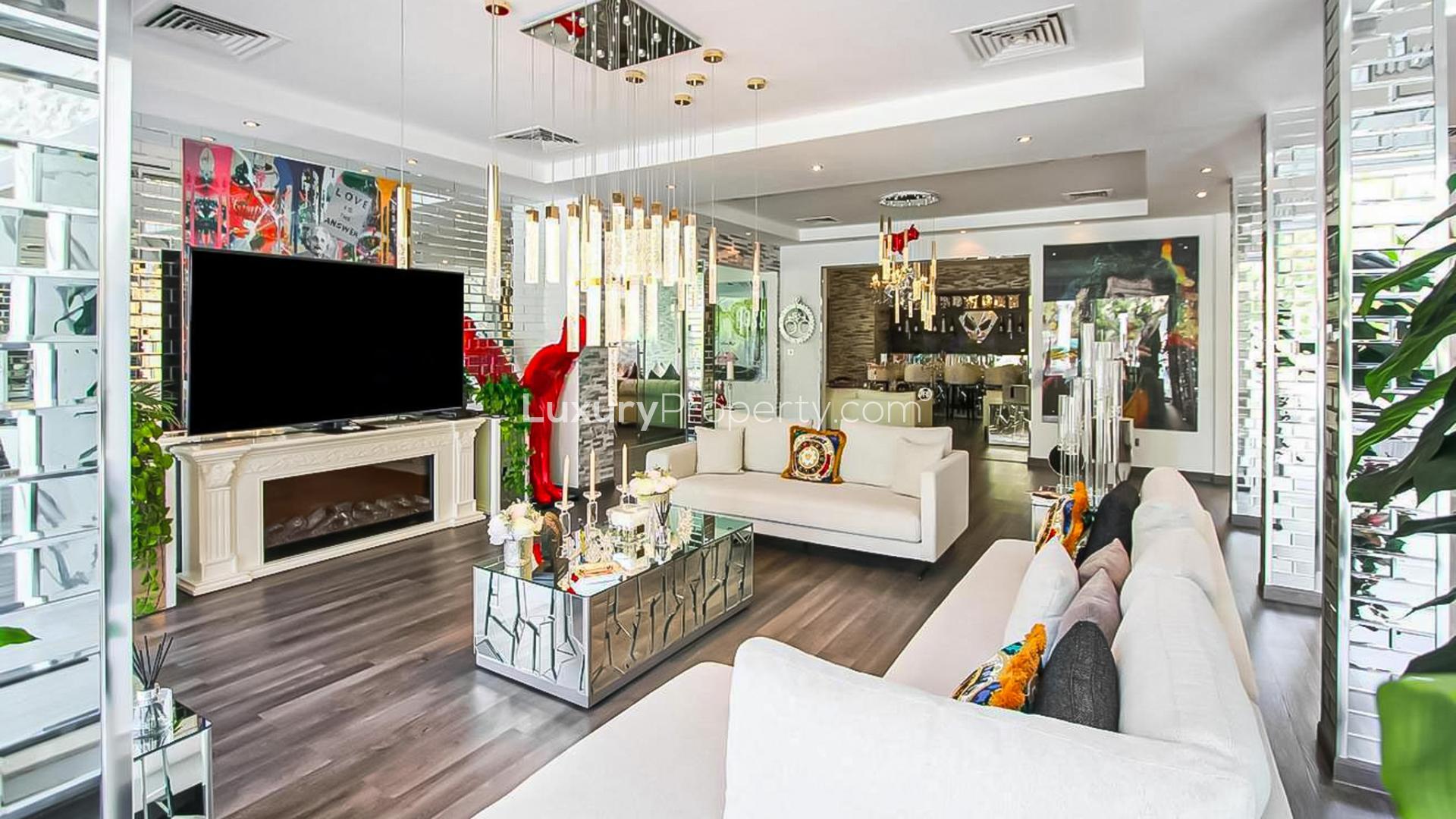 Modern living room in Arabian Ranches villa, featuring stylish decor and ample natural light