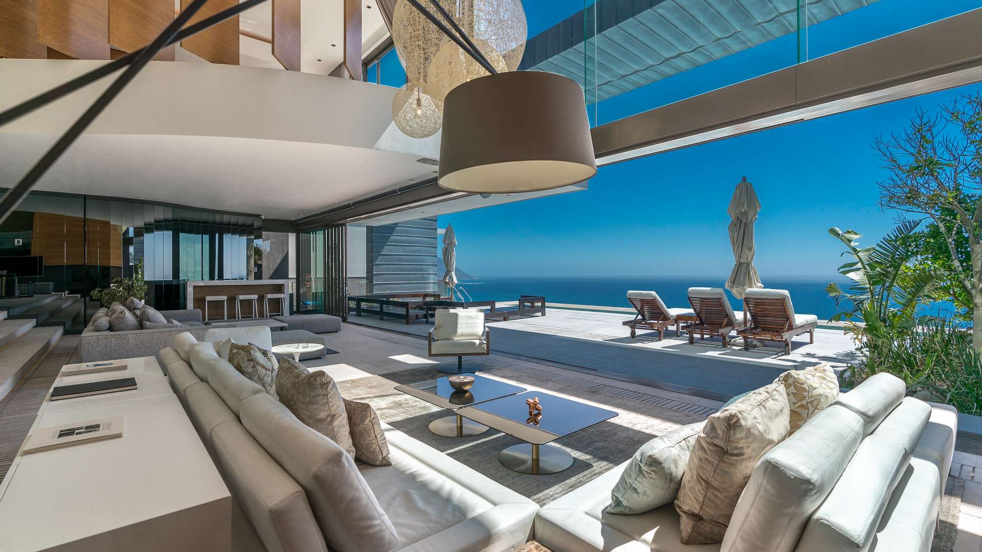Luxurious Clifton villa living room with ocean view and modern decor, Cape Town