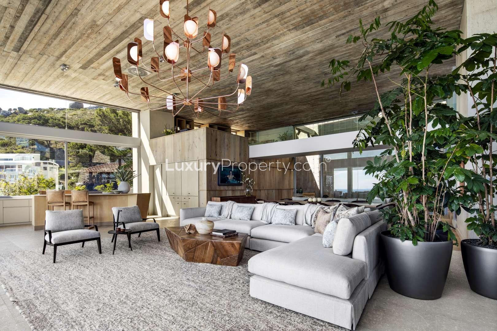 Luxurious Clifton villa living room with ocean view, modern decor, and spacious design