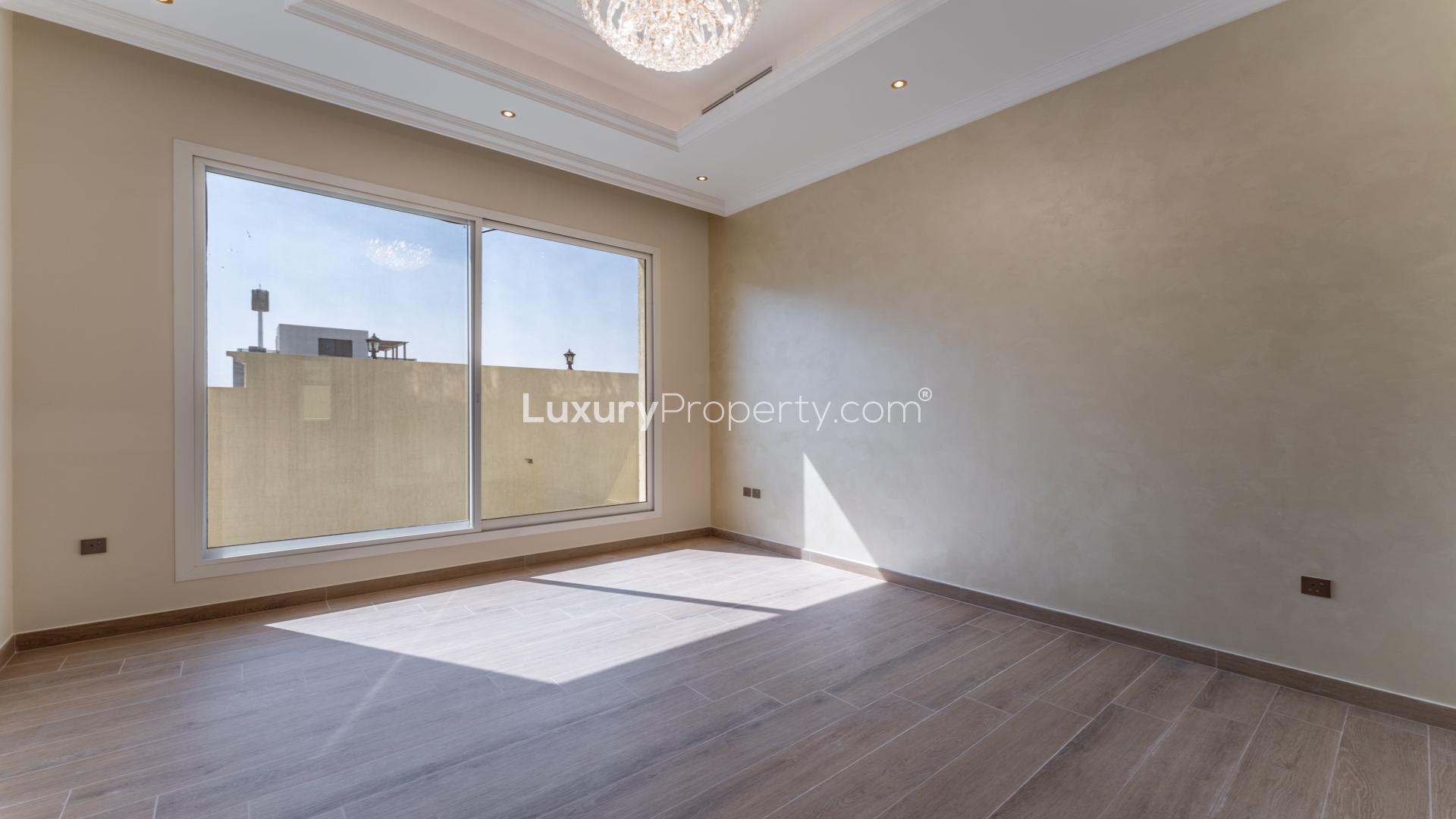 "Spacious interior with large windows in Nad Al Sheba villa for sale, LP43257.",Bright, spacious bedroom with large window in Nad Al Sheba 1 villa for sale
