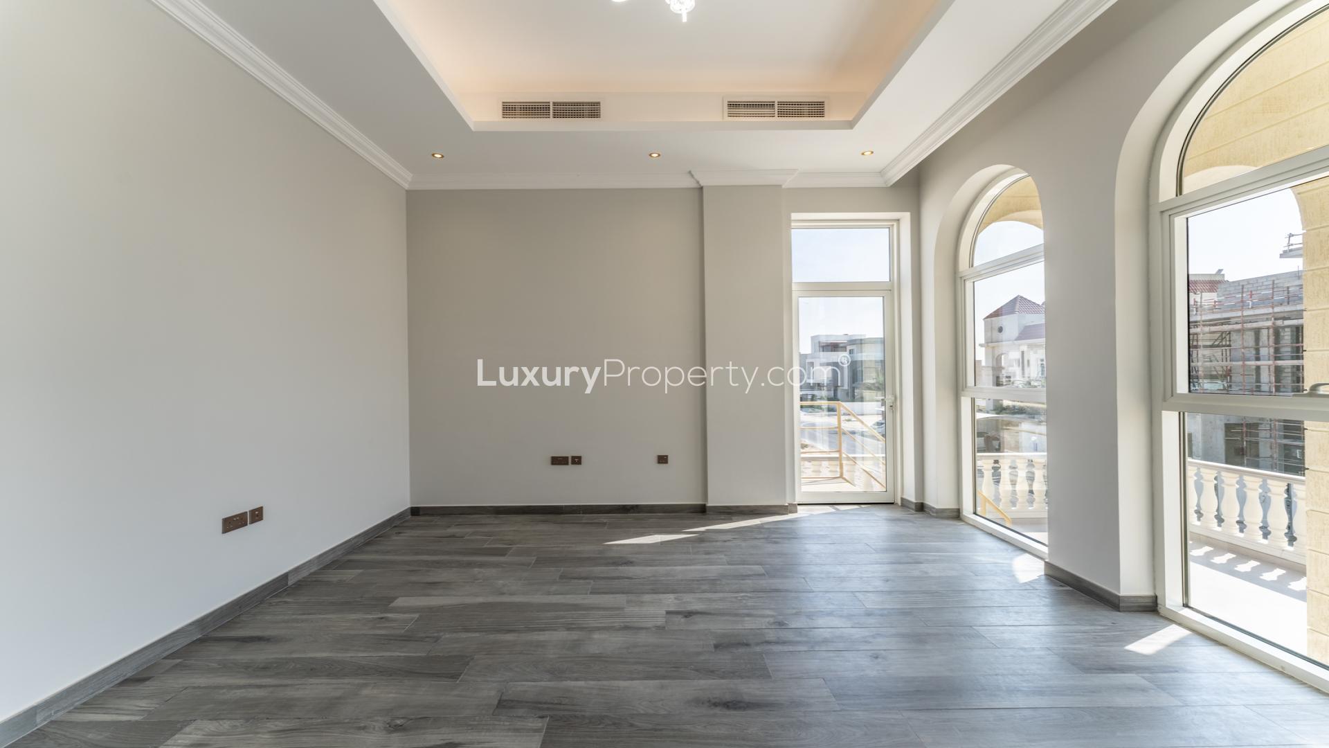 Front view of luxurious Palazzo-style villa for sale in Nad Al Sheba 1