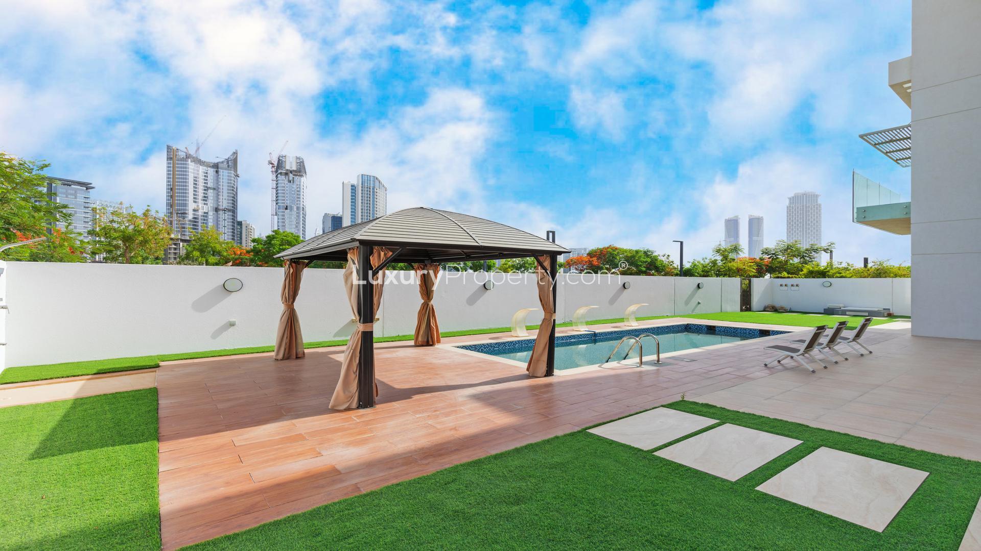 Luxurious living room in 5-bedroom villa, District One, with elegant furnishings and decor