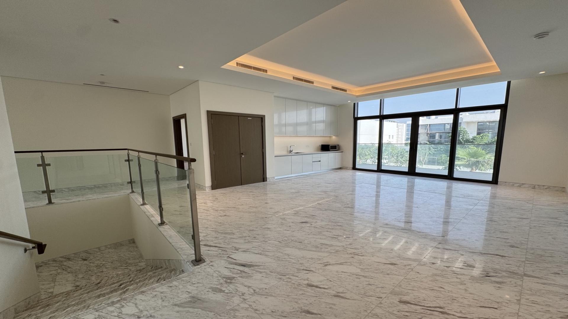 Spacious living area with marble floors in District One villa, MBR City, Dubai