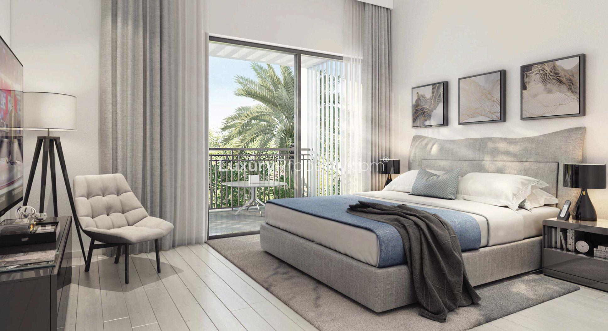 Luxurious dining and living area with golf course views in Dubai South villa