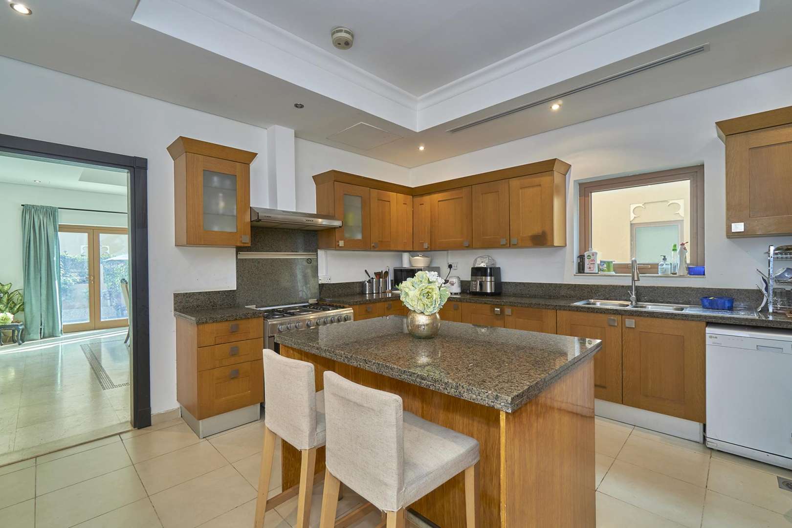 Luxurious living room in 5-bedroom villa, Al Furjan North Village, Dubai, with chandeliers