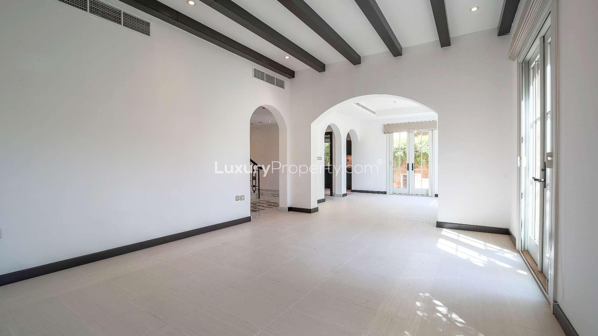 Modern kitchen in Whispering Pines villa, Jumeirah Golf Estates, with sleek cabinetry and appliances