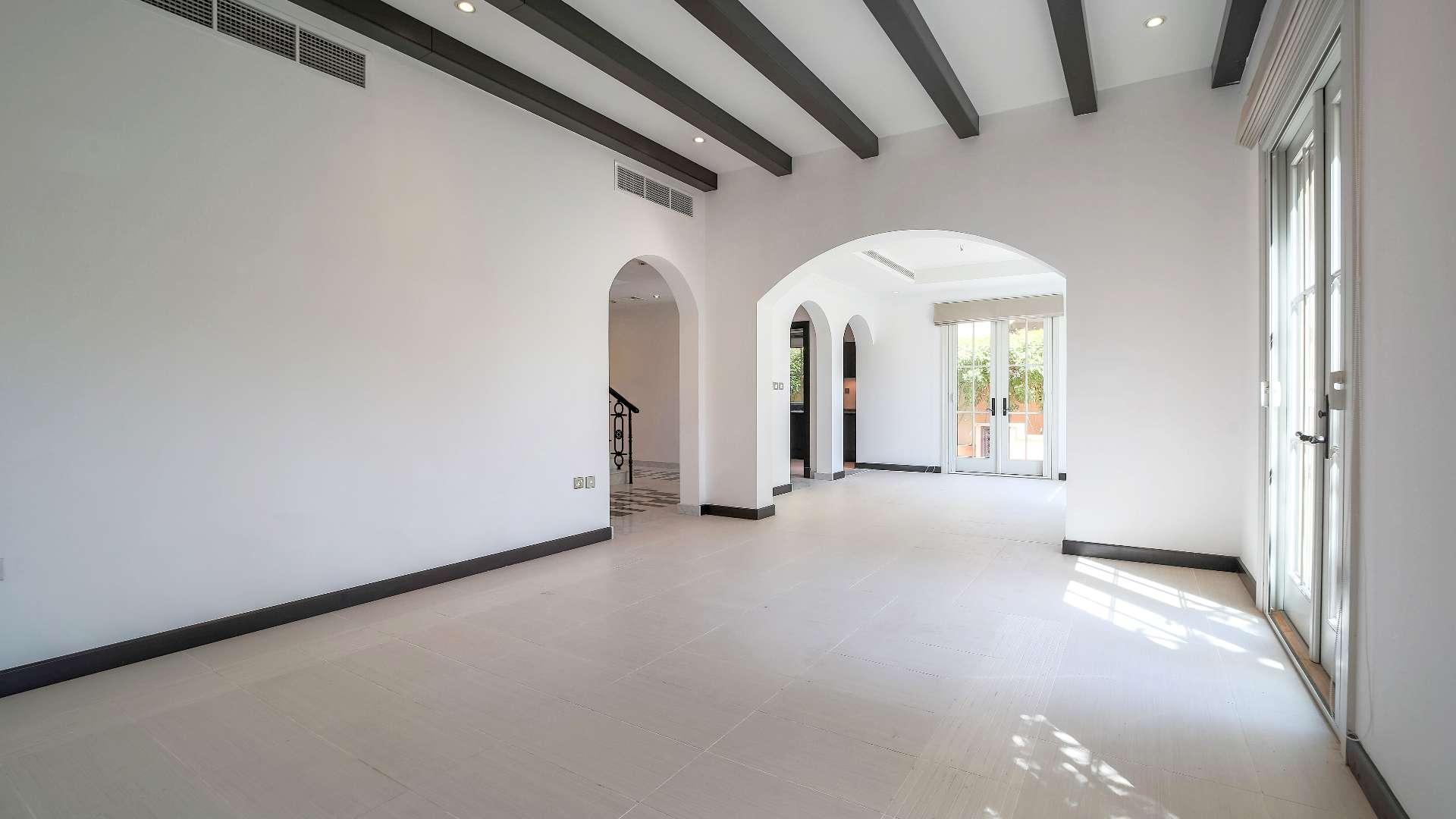 Modern kitchen in Whispering Pines villa, Jumeirah Golf Estates, with sleek cabinetry and appliances