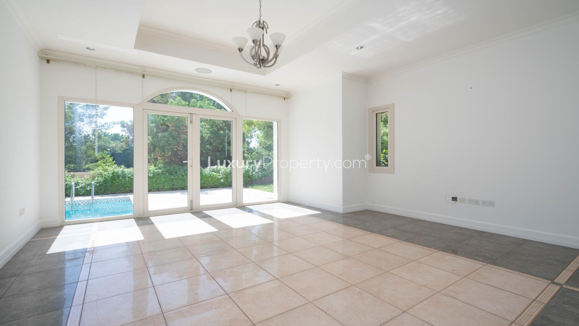 Open-plan villa interior with garden view in Jumeirah Golf Estates, Earth community