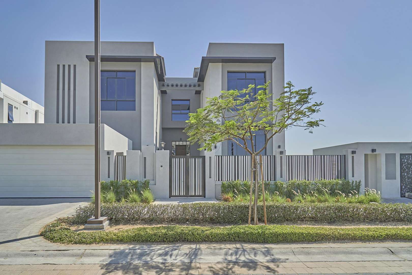 Empty modern living room with large window in Dubai Hills Estate villa for sale