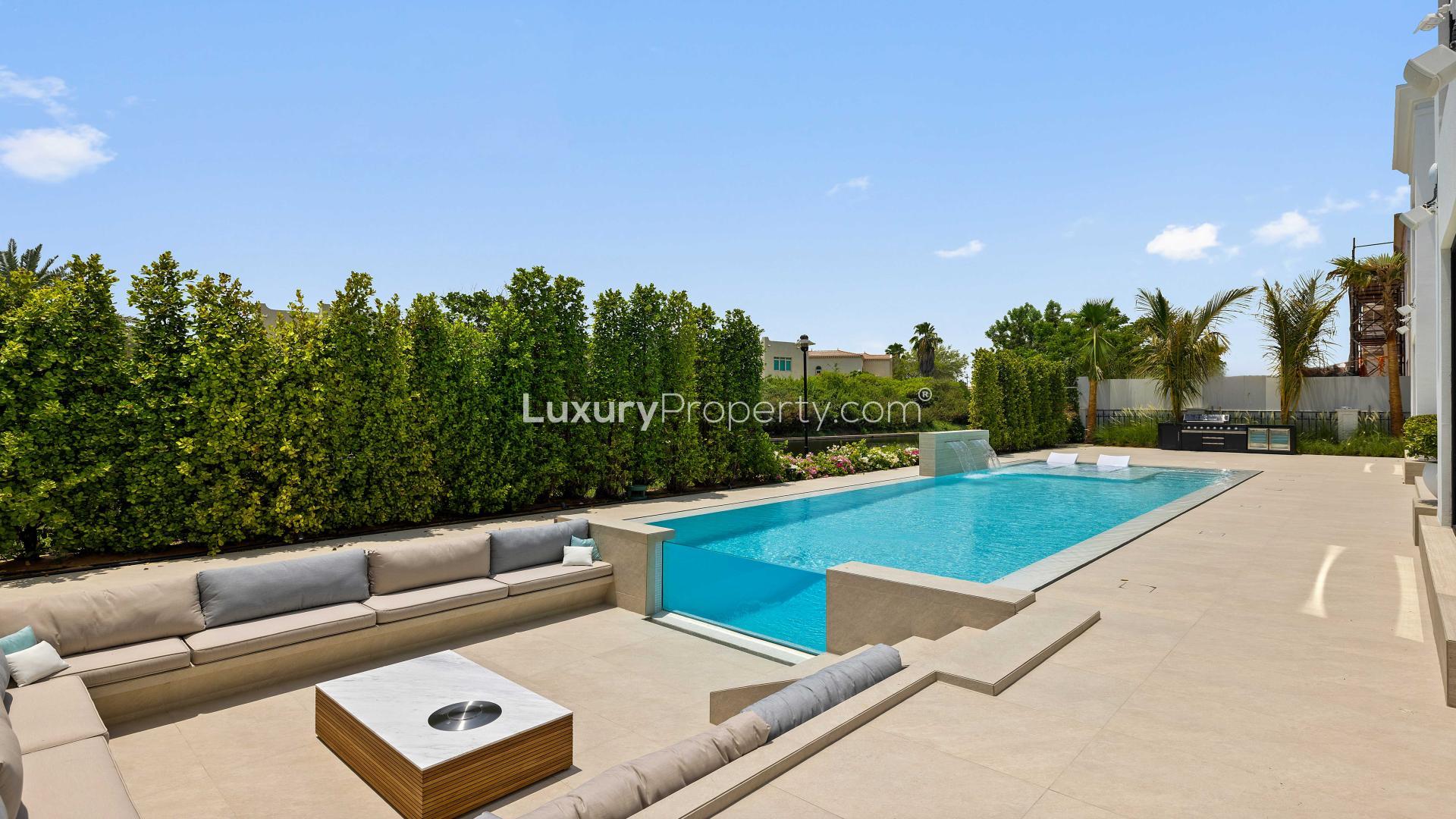 Modern Vastu-compliant villa exterior with landscaped garden in Jumeirah Islands, Dubai