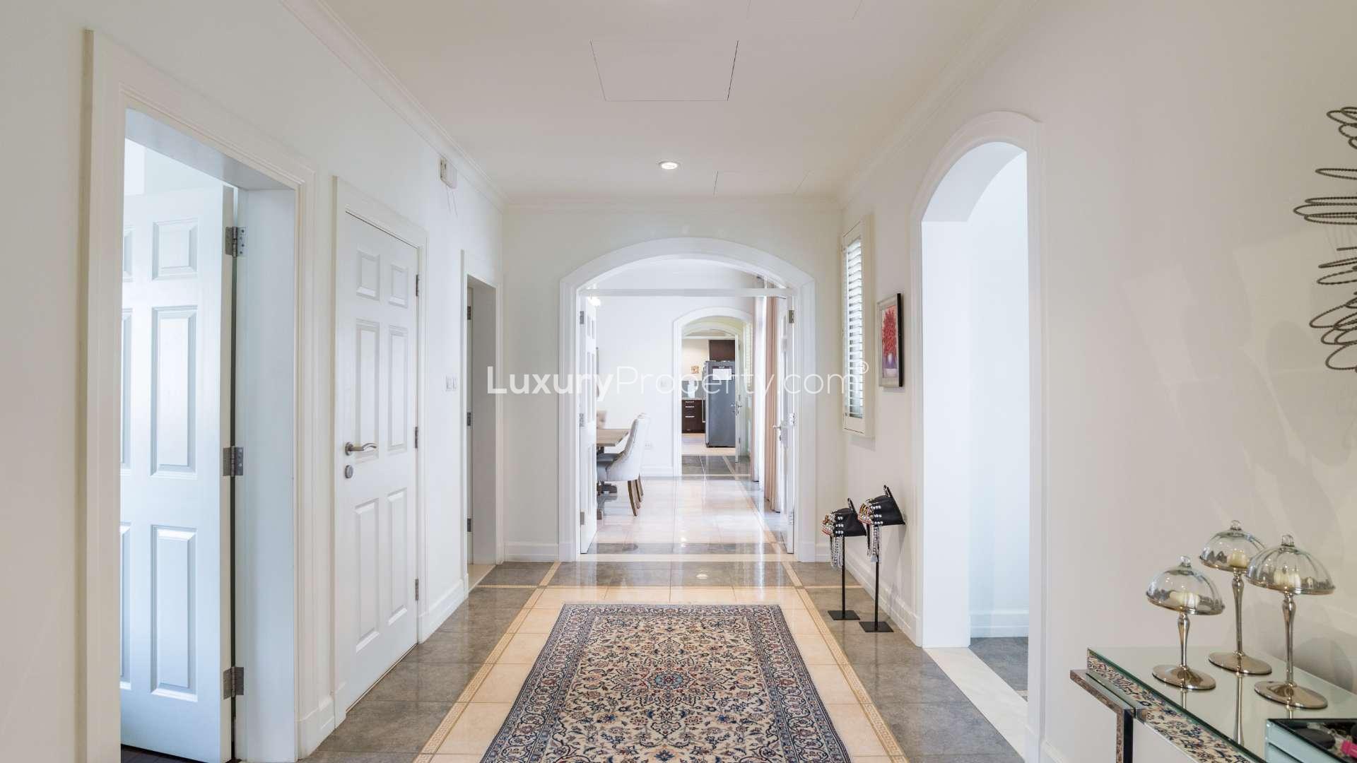 Luxurious villa view, serene lake and lush greenery in Jumeirah Golf Estates, Sienna Lakes