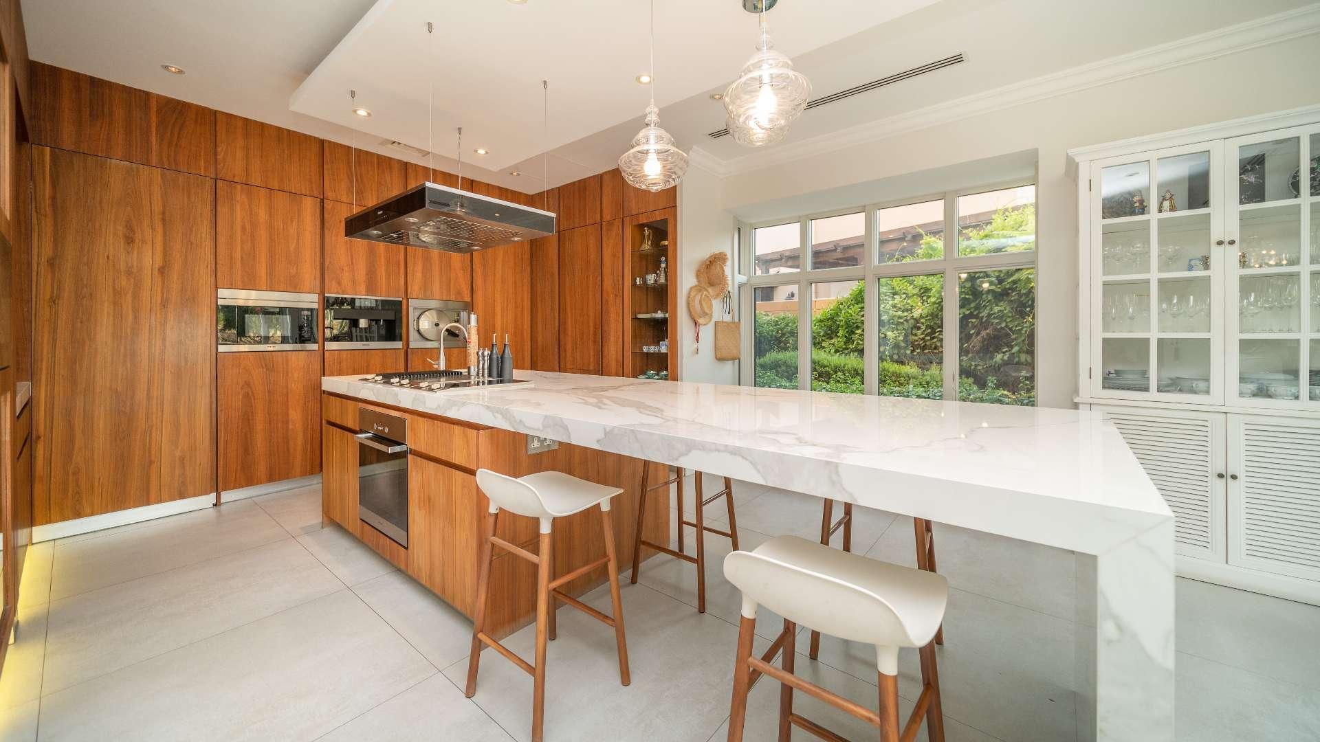 Upgraded villa exterior in Jumeirah Golf Estates Fire community, featuring elegant architecture