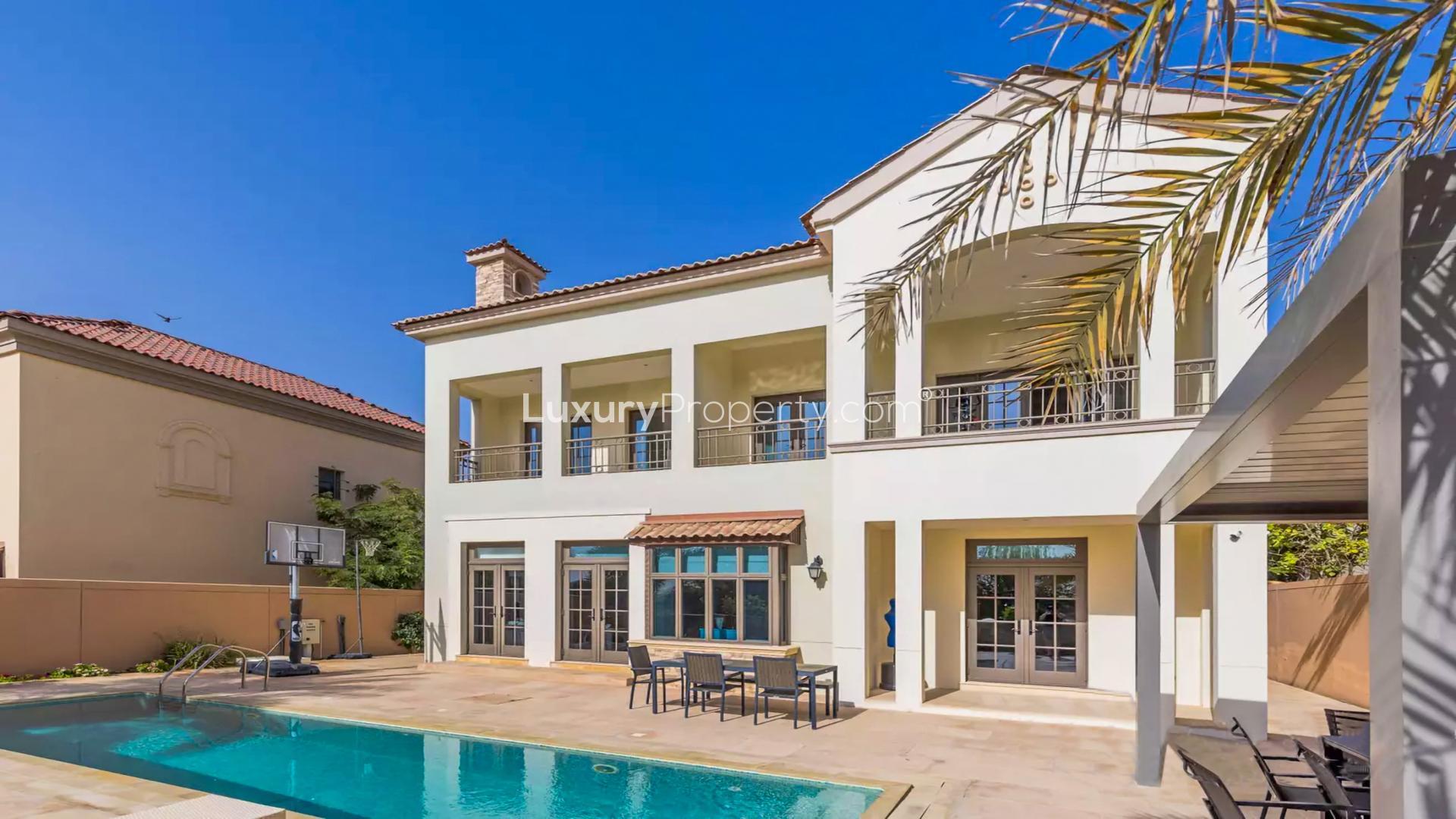 Stunning 5-bedroom villa exterior in Jumeirah Golf Estates, Fire community, with lush landscaping