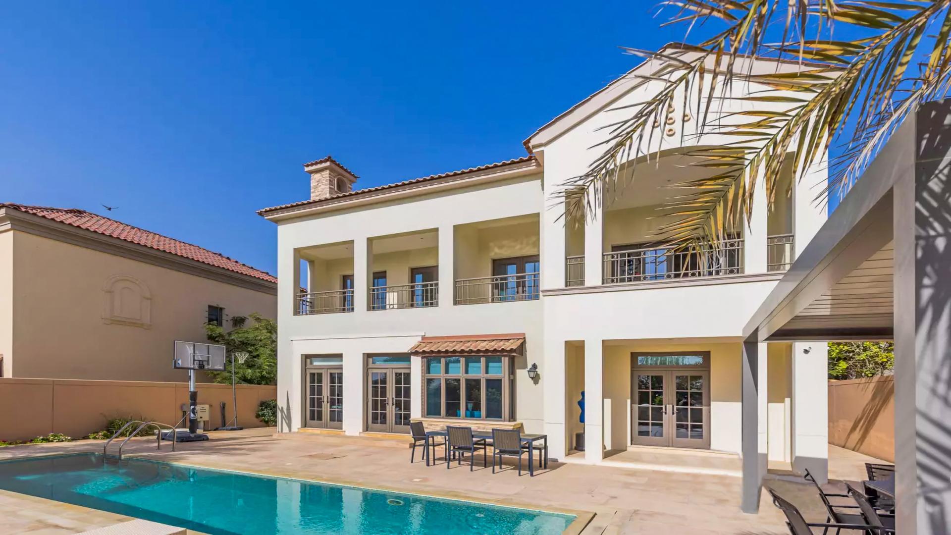 Stunning 5-bedroom villa exterior in Jumeirah Golf Estates, Fire community, with lush landscaping