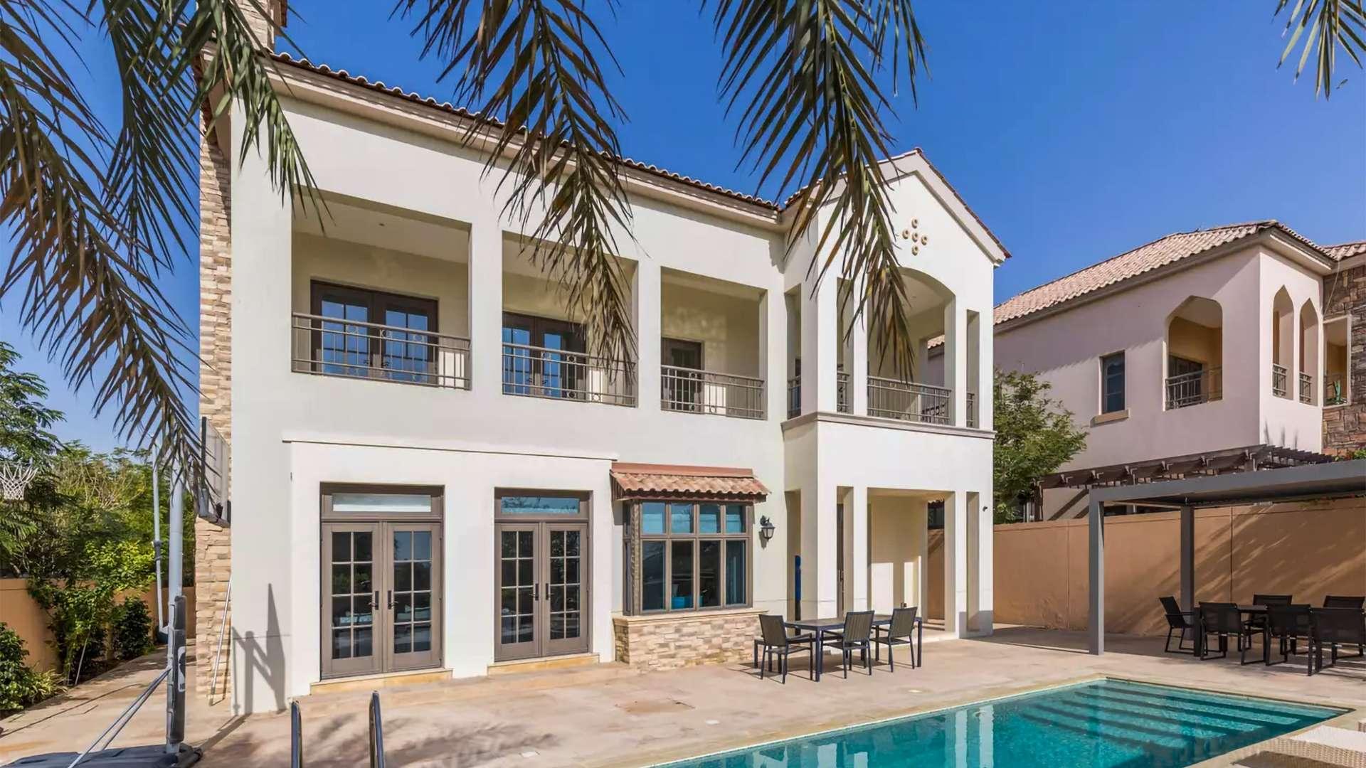 Elegant living room in 5-bedroom villa, Jumeirah Golf Estates, with natural light and stylish decor