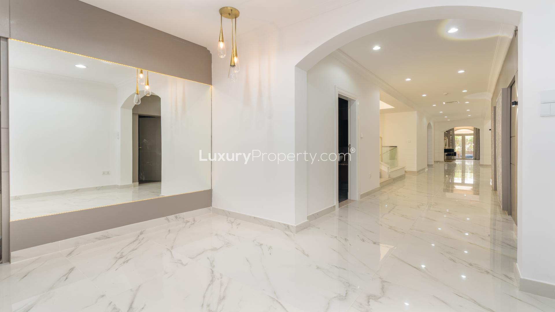 Luxurious interior of five-bed villa in Jumeirah Golf Estates, featuring elegant marble flooring