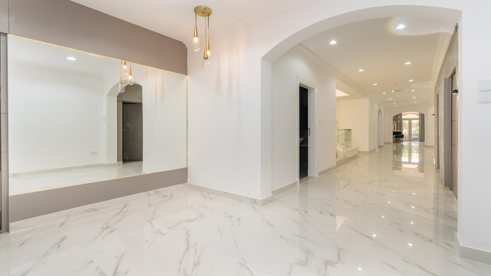 Luxurious interior of five-bed villa in Jumeirah Golf Estates, featuring elegant marble flooring
