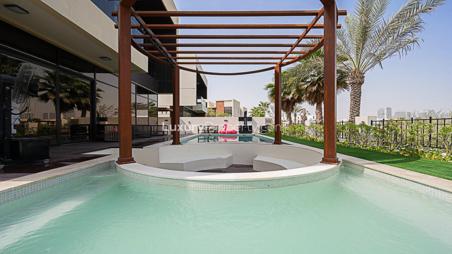 Upgraded villa exterior with pool in The Flora, Damac Hills, for sale