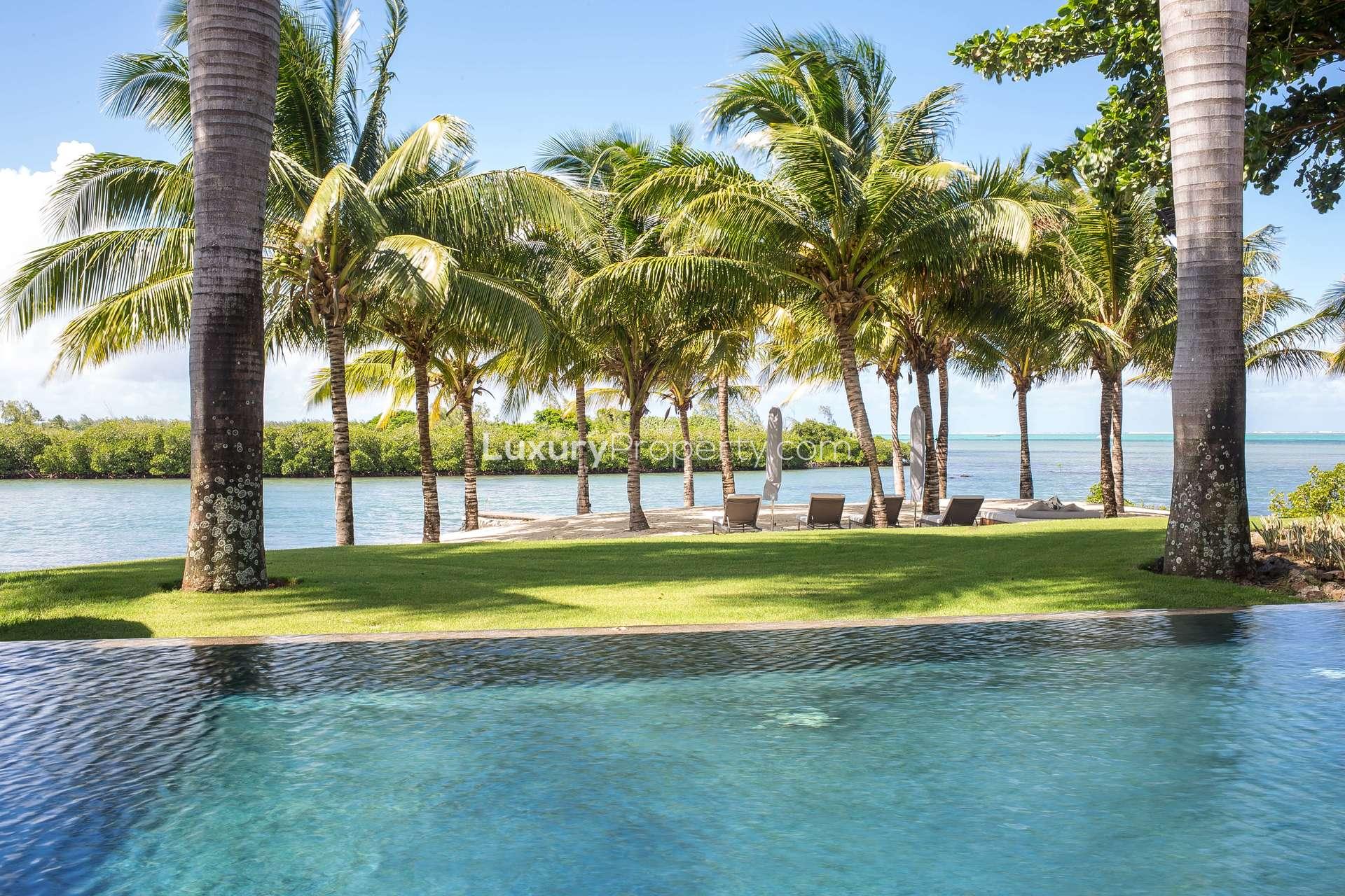 Luxurious villa with infinity pool and outdoor seating at Four Seasons Residences, Mauritius