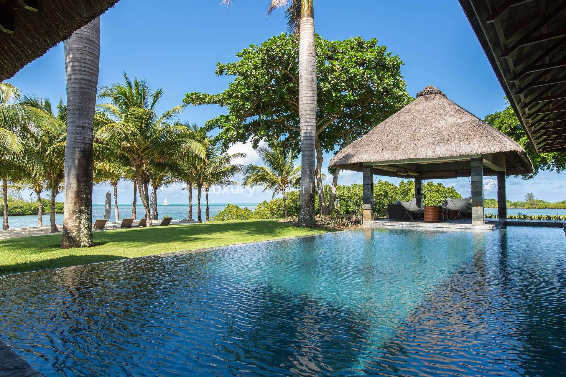 Luxurious villa with pool and palm trees at Four Seasons Residences, Mauritius