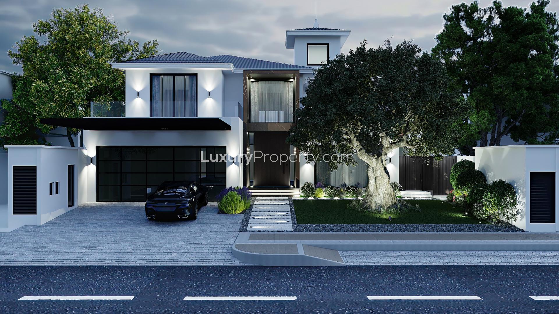 Ultra sleek contemporary villa facade in Palm Jumeirah, featuring modern design and lush garden