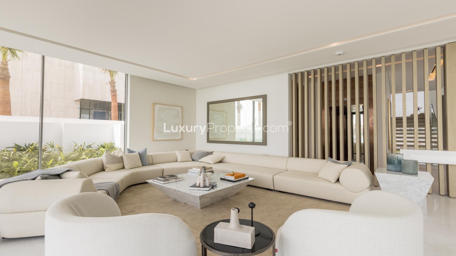 Luxurious living room in 5-bedroom villa, Palm Jumeirah, featuring modern decor and spacious design