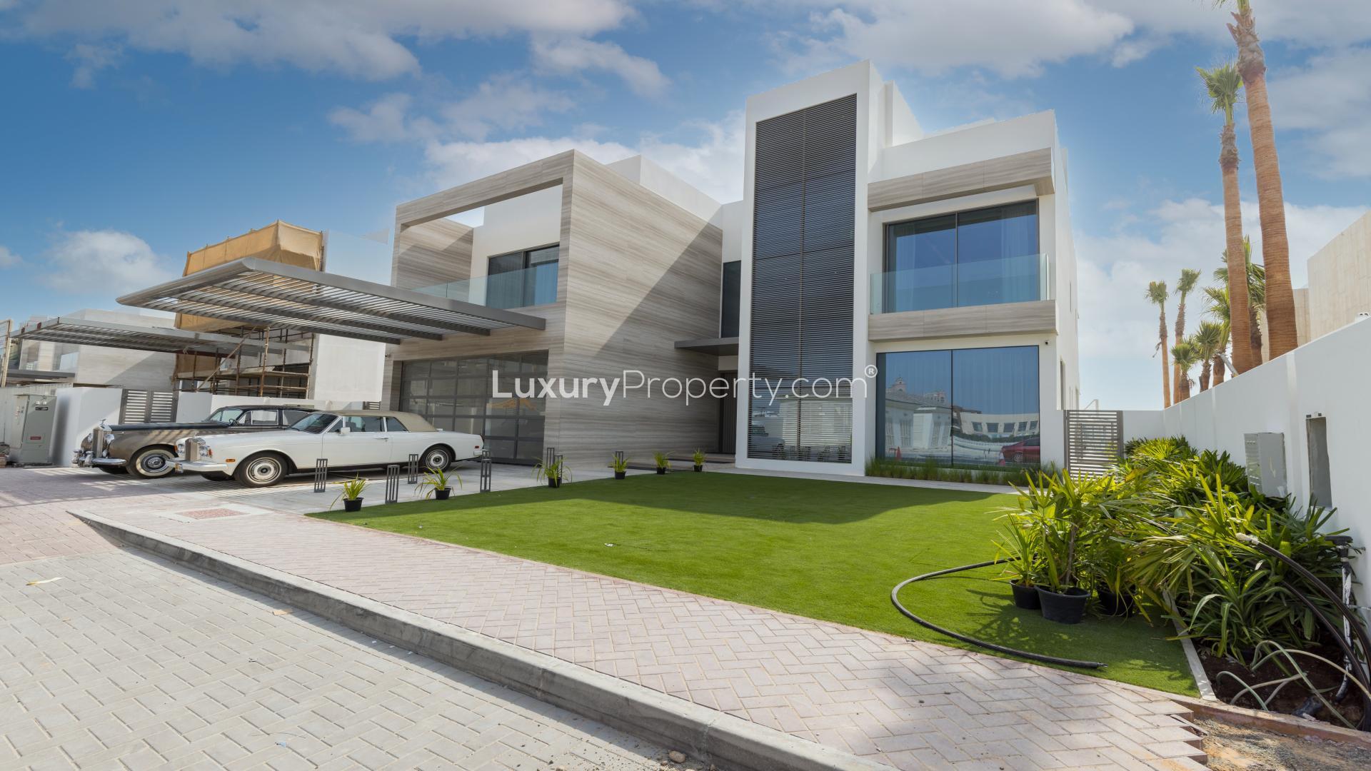 Beachfront view from Palm Jumeirah villa, showcasing serene waters and sandy shore