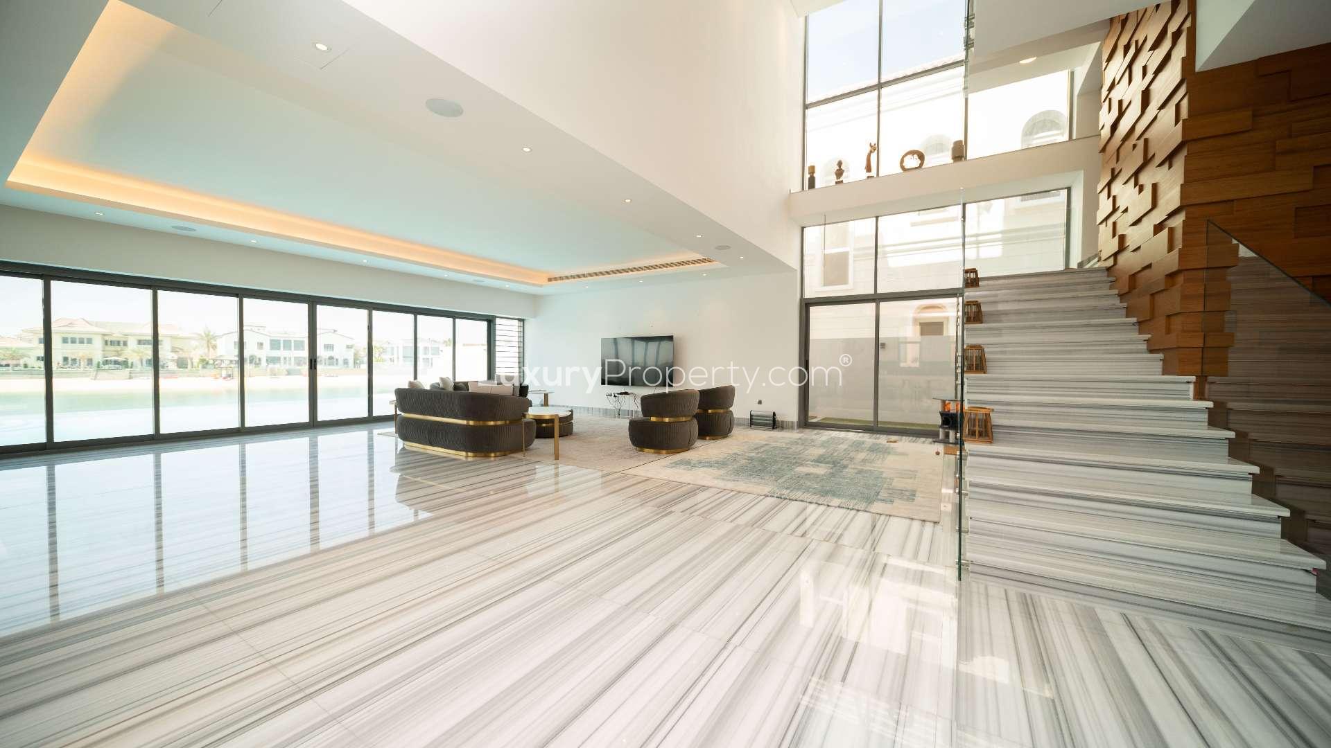 Luxurious open-plan living area in Palm Jumeirah villa with modern design and waterfront views