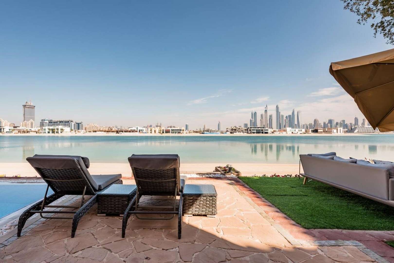 Furnished bedroom in Palm Jumeirah Garden Homes villa, featuring modern decor and natural light