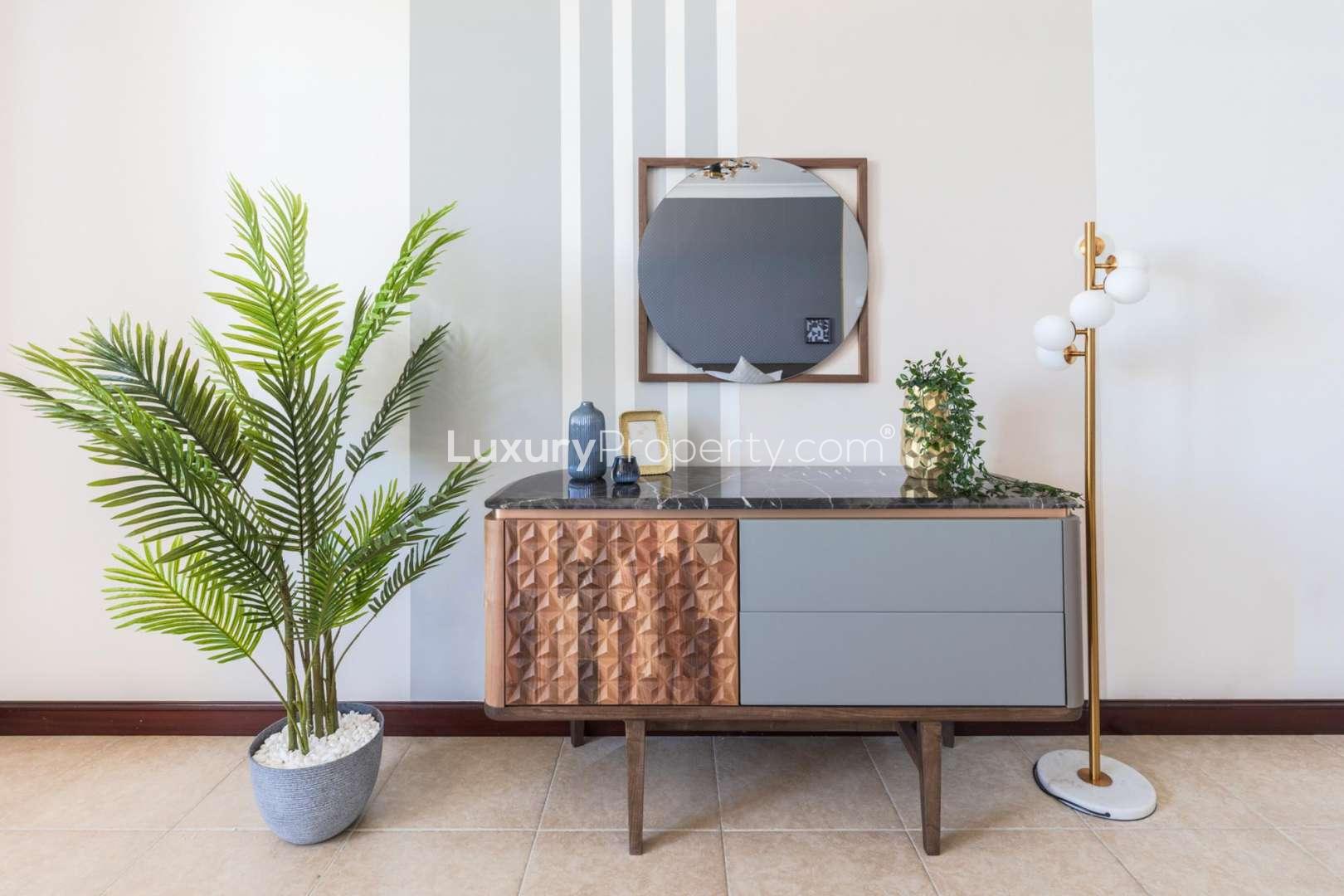 Luxurious living room in Palm Jumeirah villa with modern decor and sea view