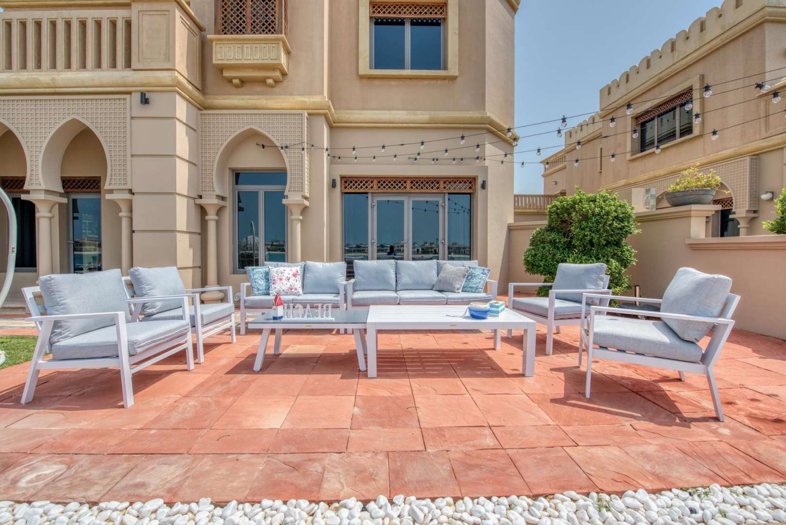 Outdoor seating area at luxury villa with private beach access on Palm Jumeirah