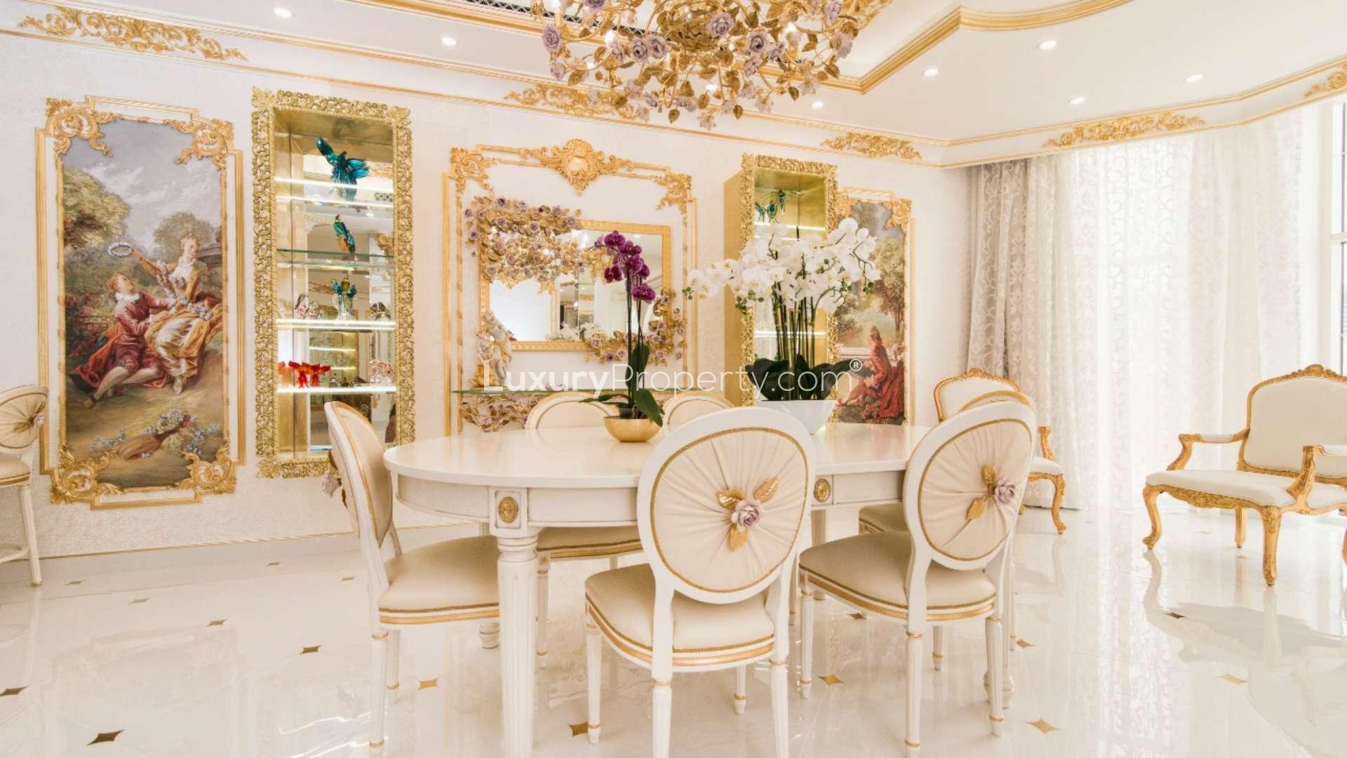 Luxurious staircase with ornate gold and floral details in Palm Jumeirah villa