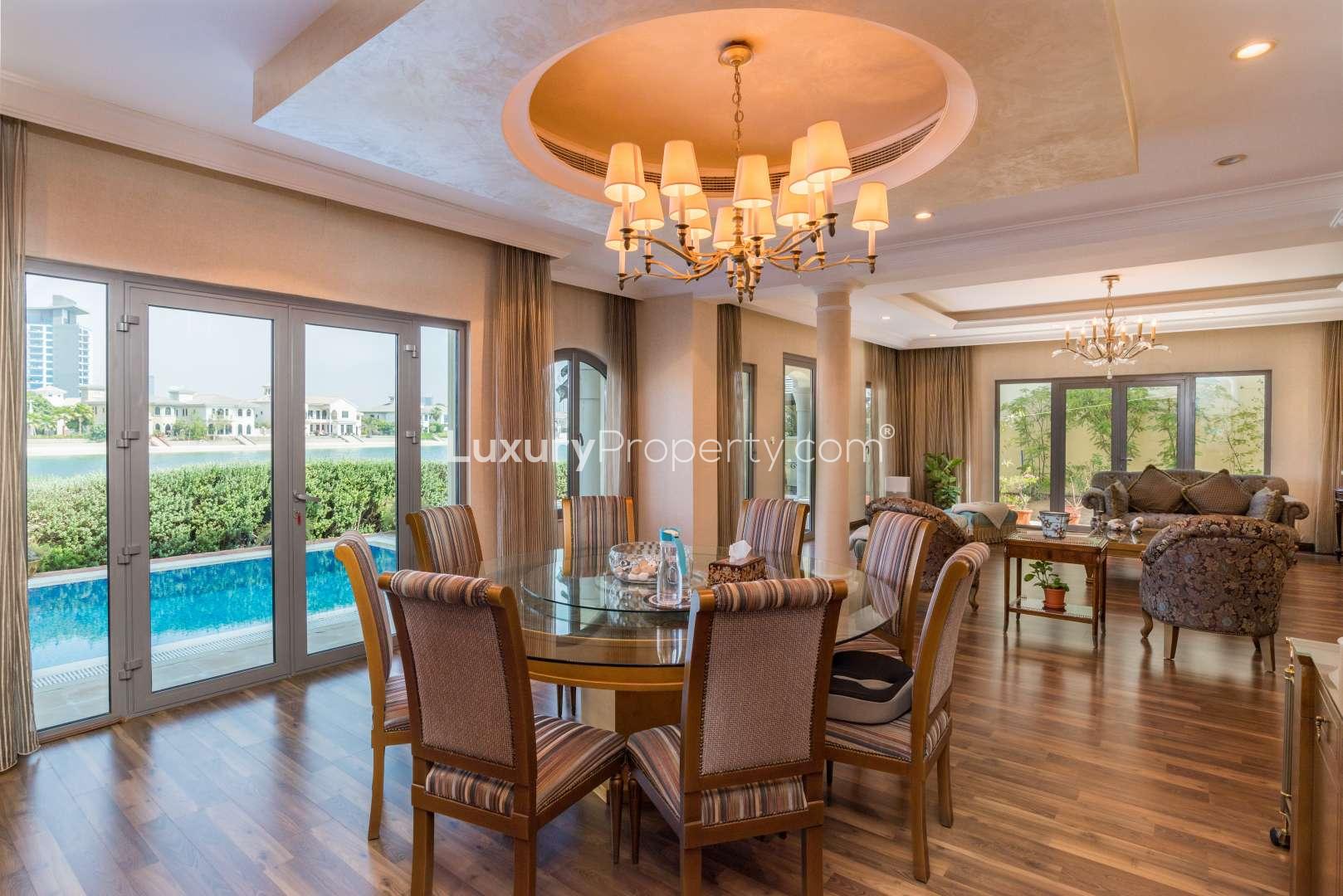Modern kitchen in upgraded Palm Jumeirah villa for sale, featuring sleek cabinetry and island