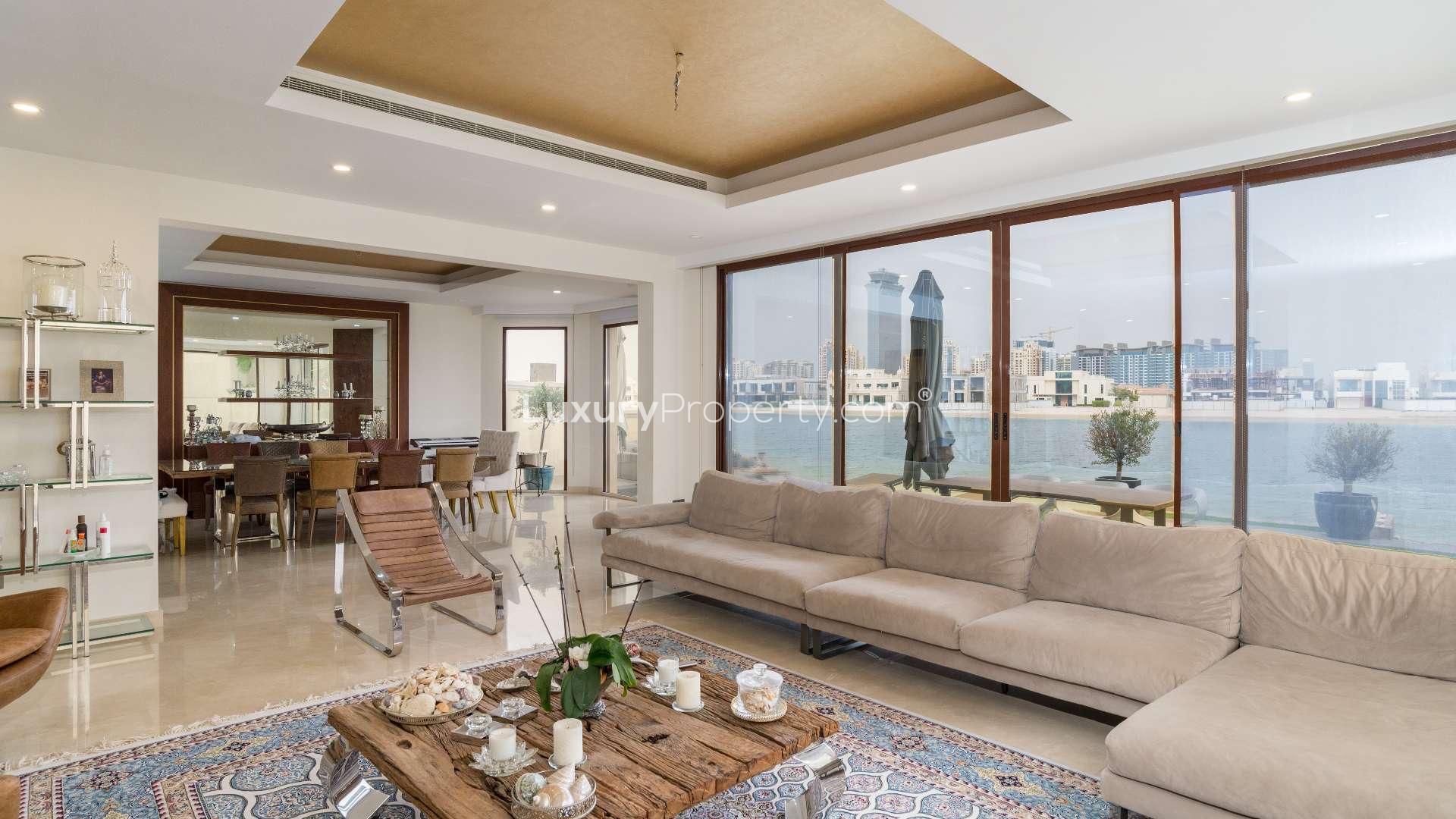 Atrium Entry Villa interior with elegant staircase and modern seating, Palm Jumeirah, for sale