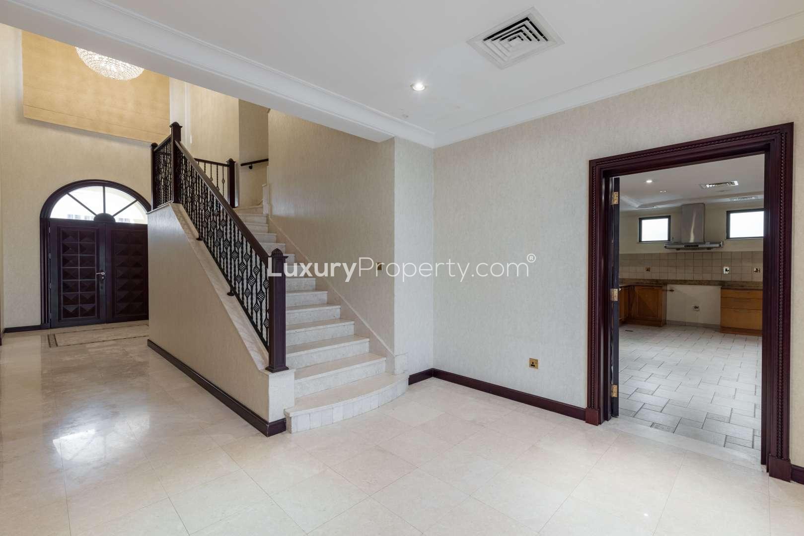 "Elegant hallway in 5-bed Atrium Entry Villa, Palm Jumeirah Garden Homes, for sale.",Elegant entrance and staircase in Palm Jumeirah 5-bedroom villa for sale, Garden Homes