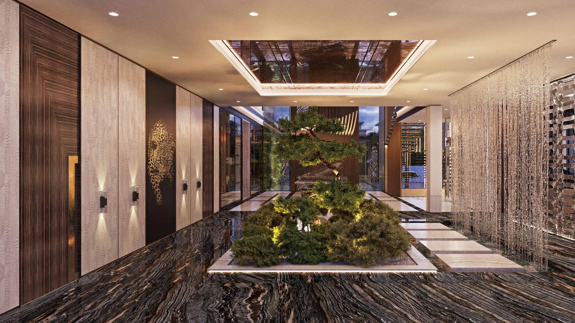 Luxurious living room in Gems Estates Villa, Damac Hills with elegant decor and modern fireplace