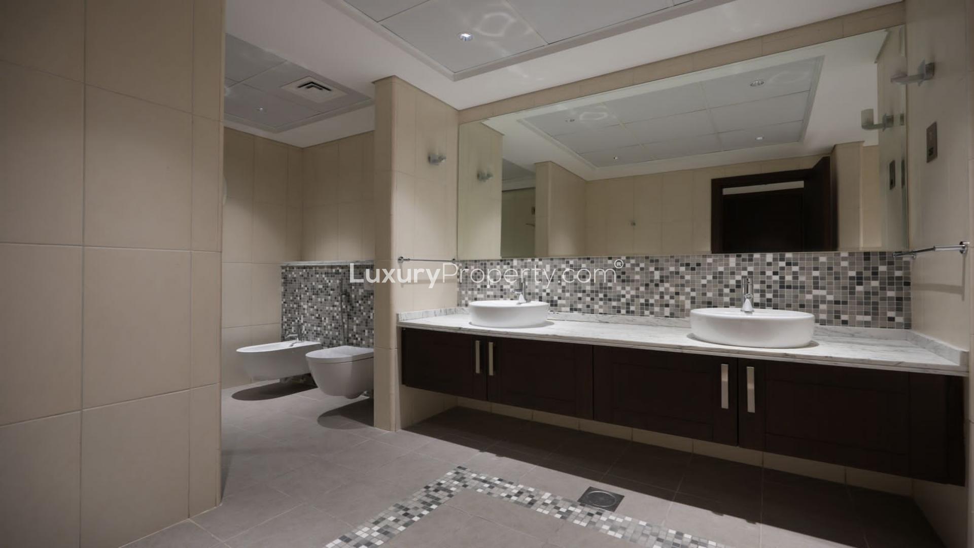 Modern kitchen in Jumeirah Park Legacy villa for sale, featuring sleek cabinetry and appliances