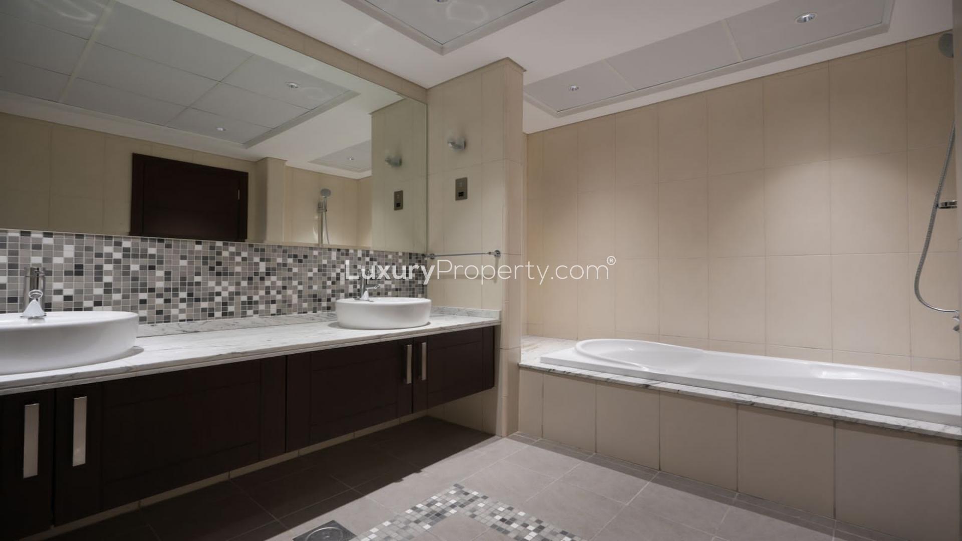 Modern bathroom with double sinks and mosaic tiles in Jumeirah Park Legacy villa for sale