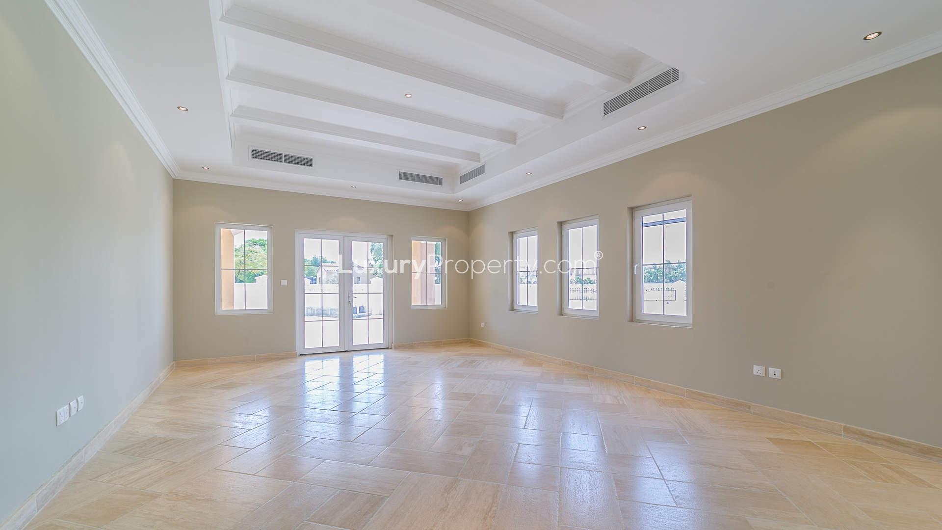 Spacious living area with high ceilings in Arabian Ranches Golf Homes villa for sale