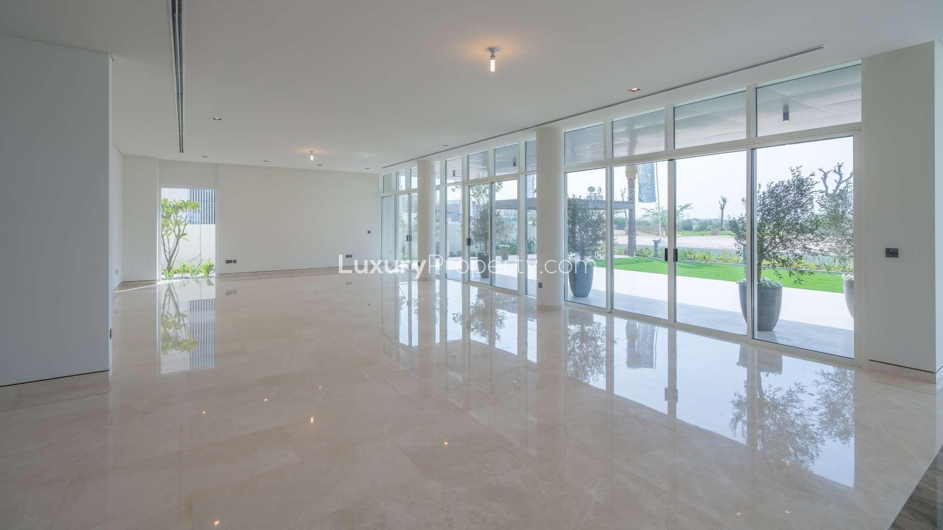 Modern hallway in Dubai Hills Estate villa, featuring wooden accents and marble flooring