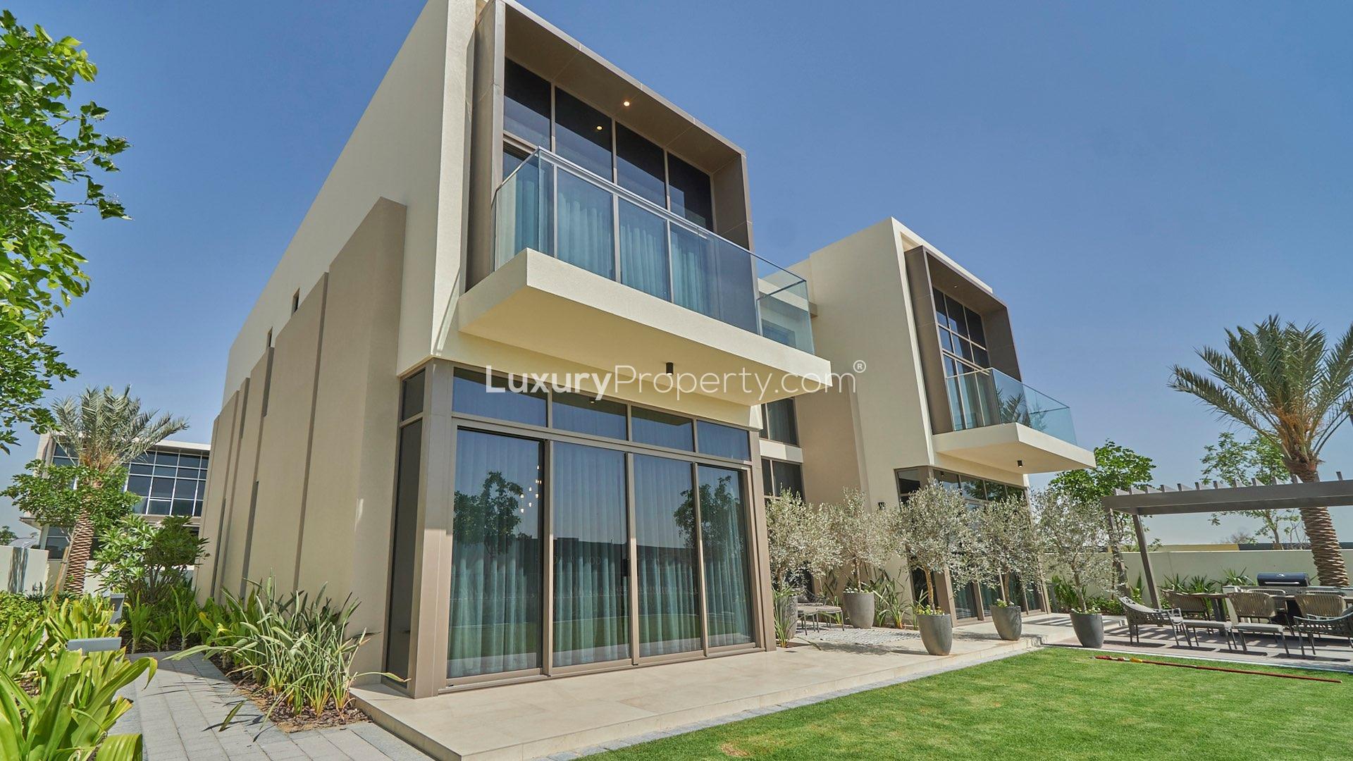 Elegant 5-bedroom villa exterior in Golf Place, Dubai Hills Estate, with lush garden view