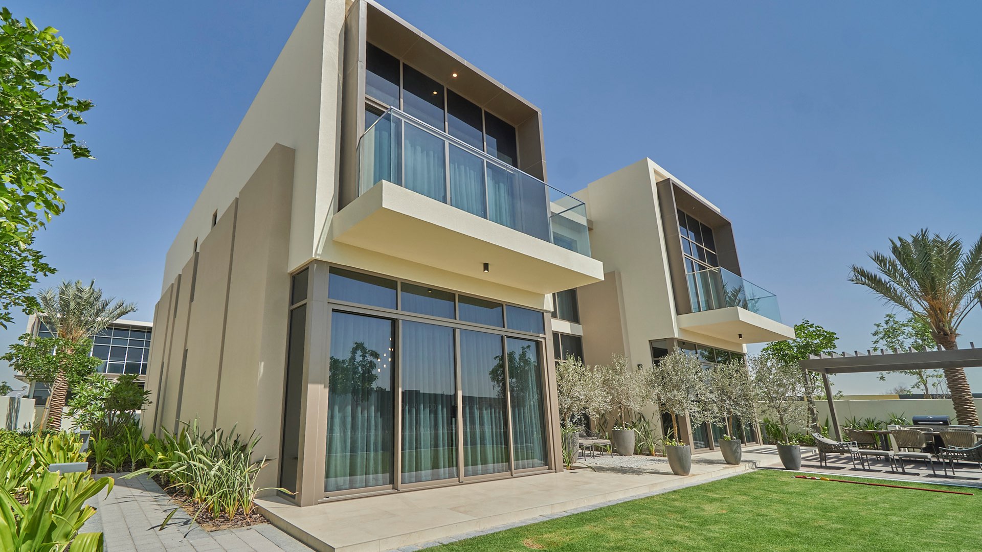 Elegant 5-bedroom villa exterior in Golf Place, Dubai Hills Estate, with lush garden view